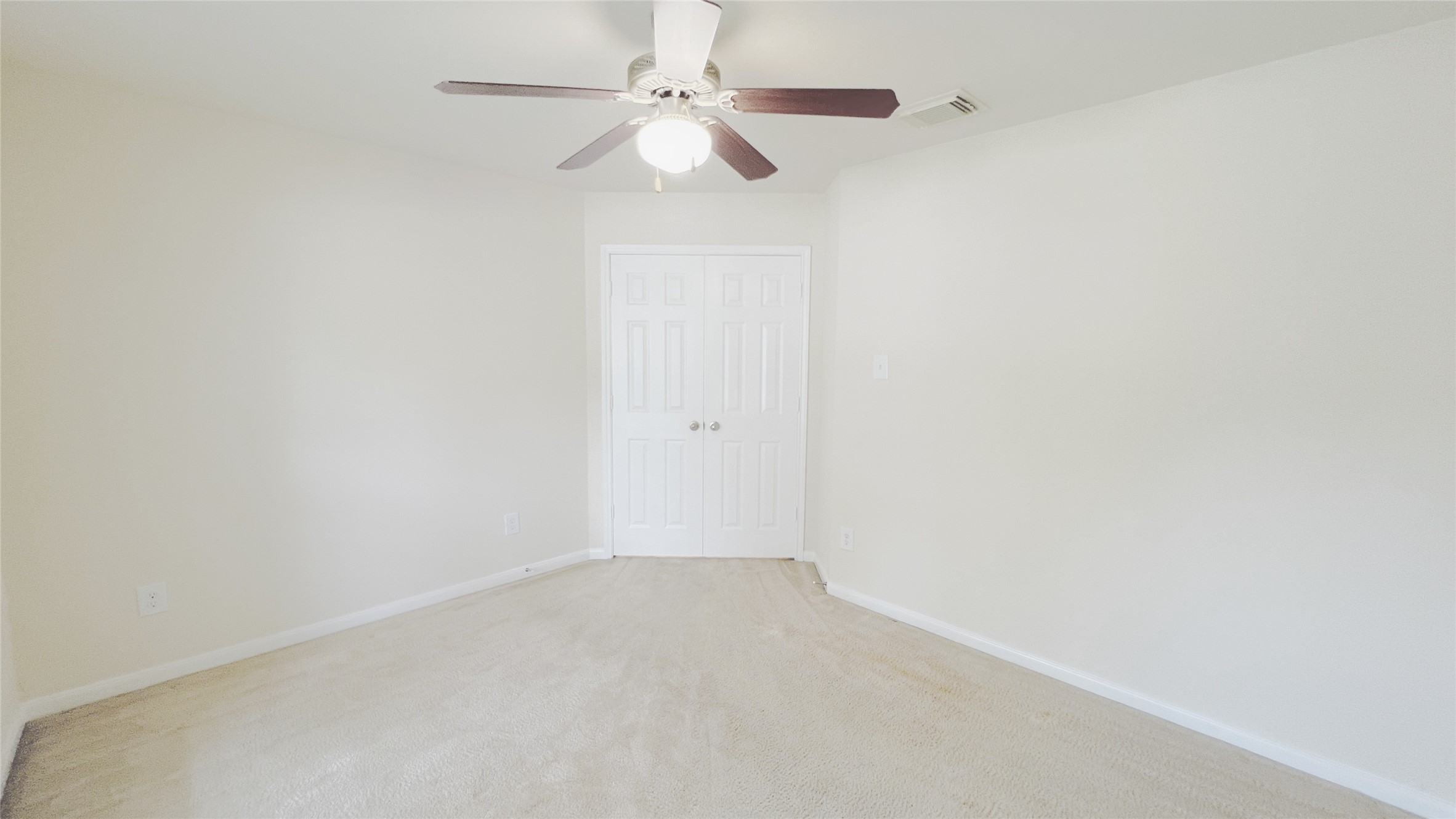 21338 Bella Mountain Drive Spring, TX 77379 - Photo 12 of 33 an empty room with a window and a fan