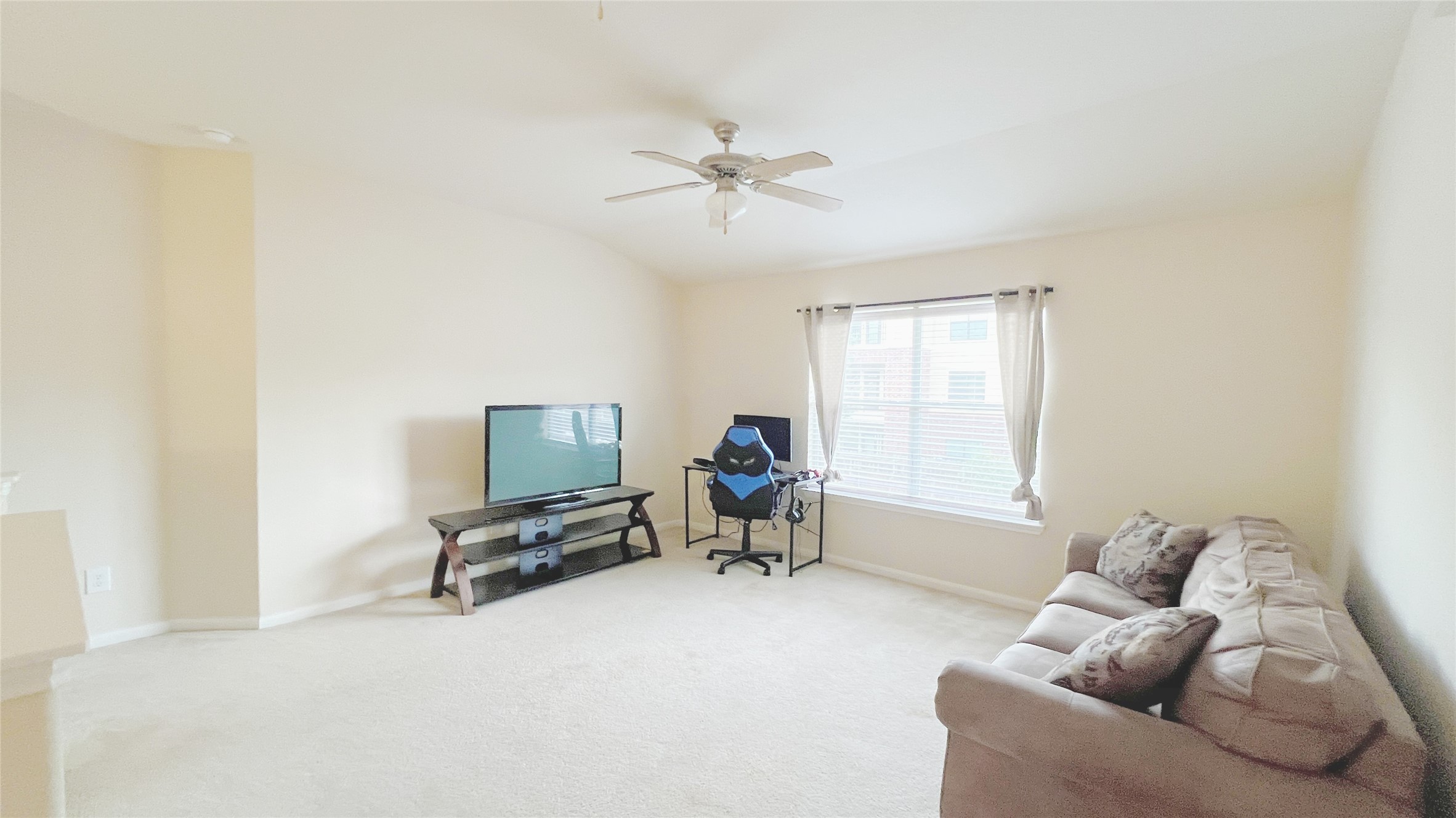 21338 Bella Mountain Drive Spring, TX 77379 - Photo 17 of 33 a living room with furniture and a window
