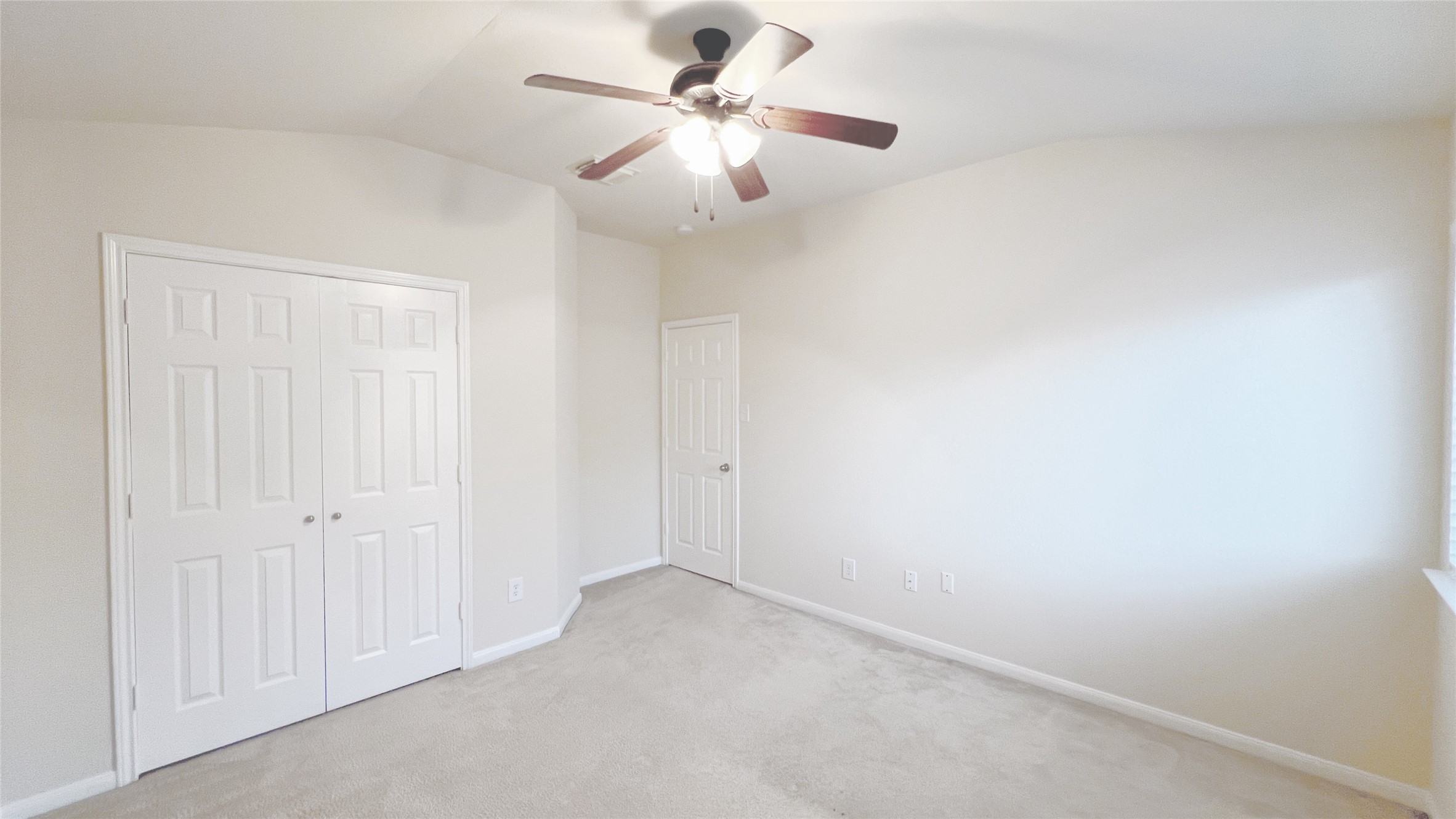 21338 Bella Mountain Drive Spring, TX 77379 - Photo 19 of 33 an empty room with a chandelier fan