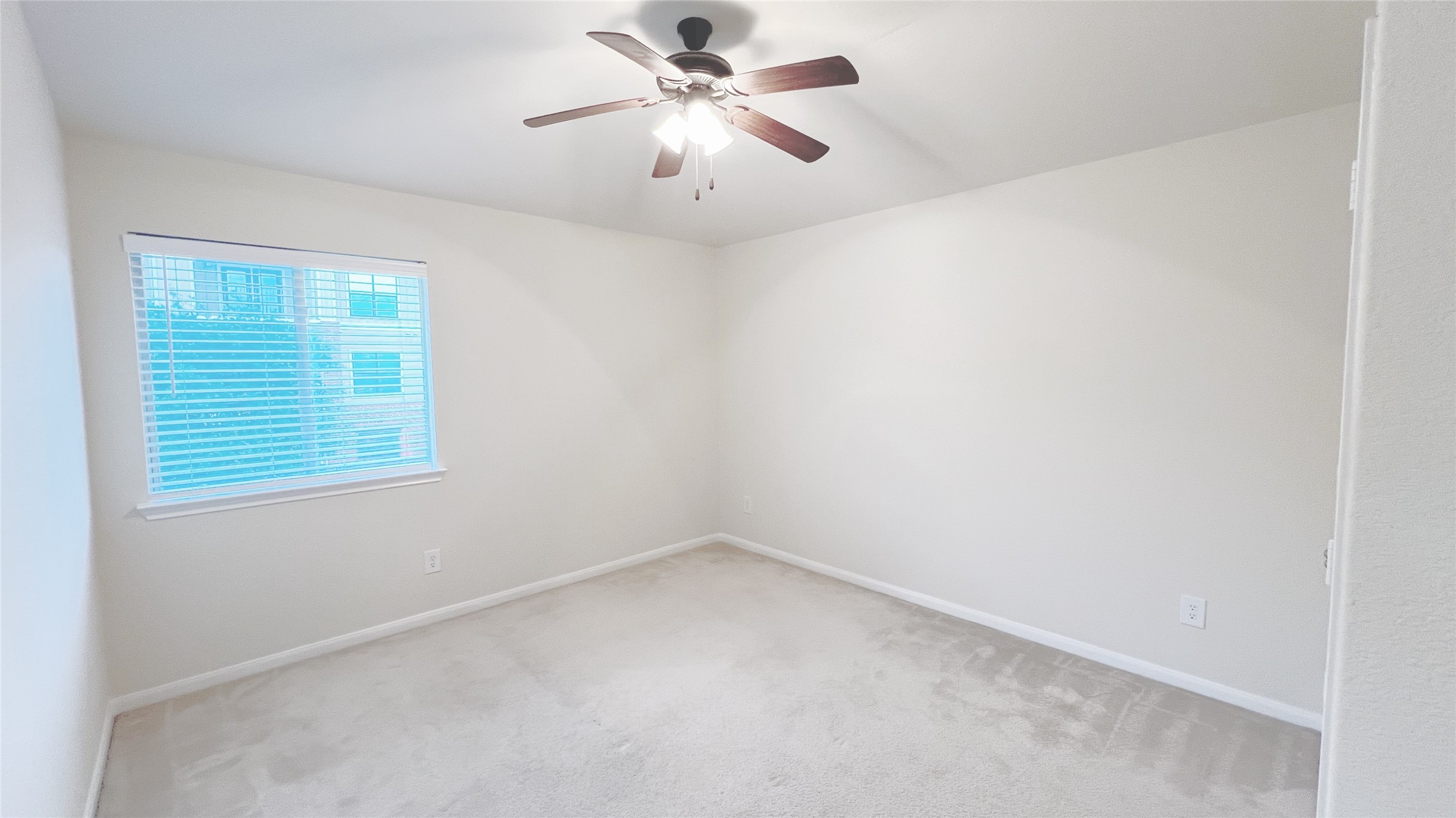 21338 Bella Mountain Drive Spring, TX 77379 - Photo 20 of 33 an empty room with a window and a fan
