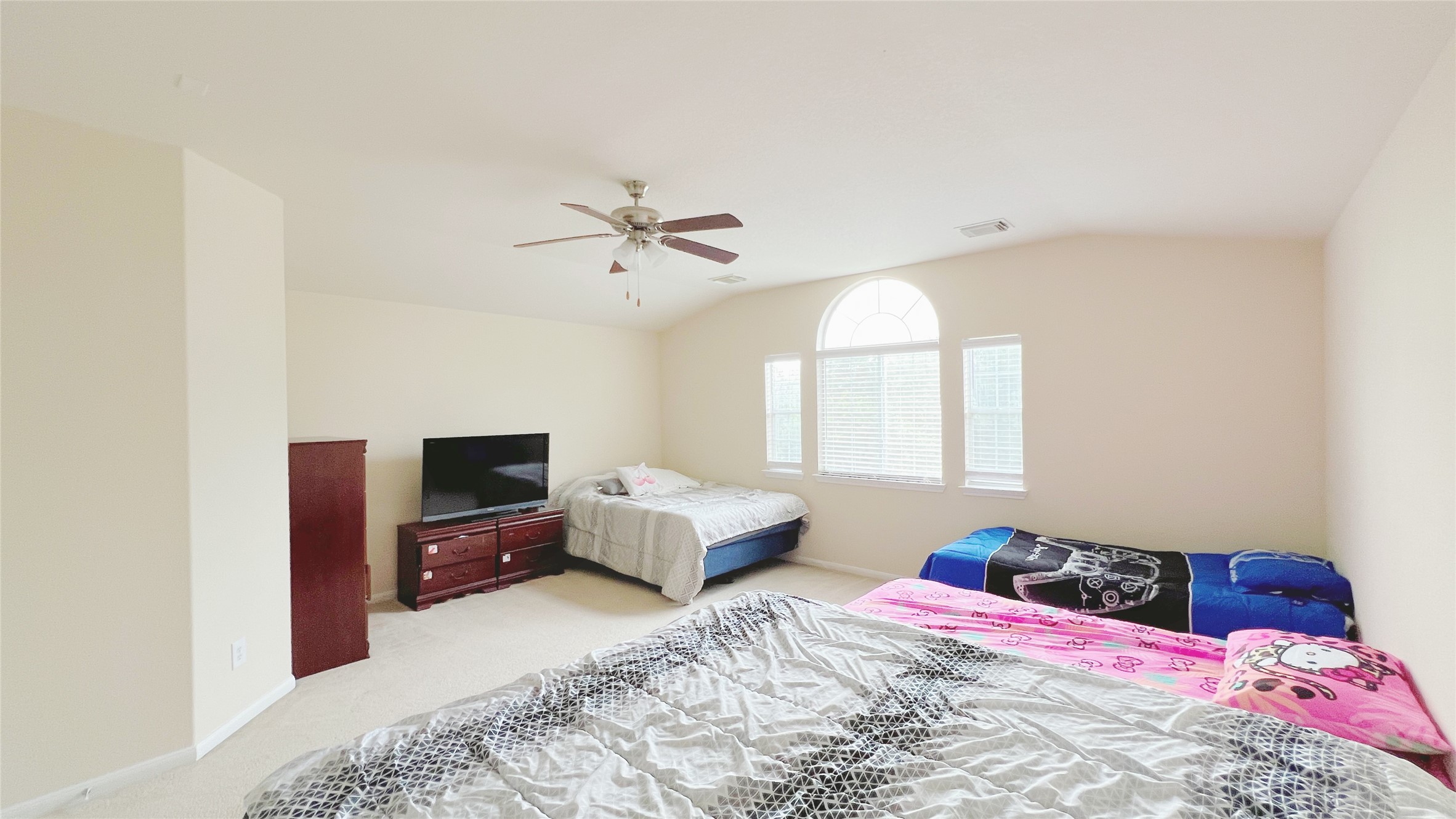 21338 Bella Mountain Drive Spring, TX 77379 - Photo 23 of 33 a bedroom with a bed and a tv