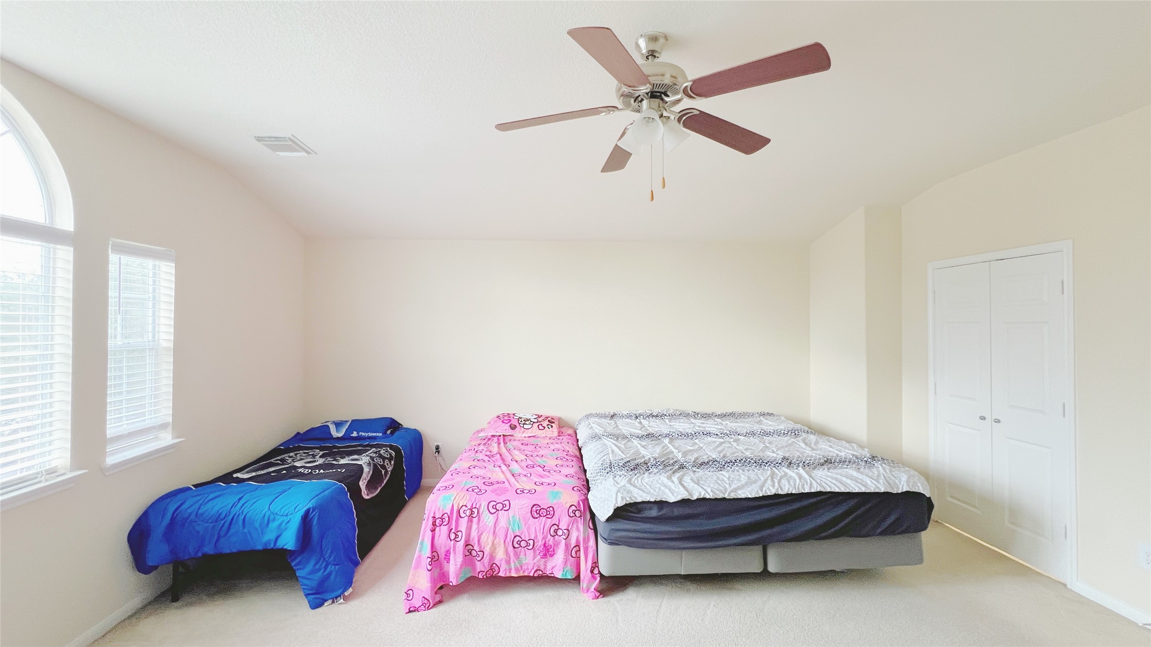 21338 Bella Mountain Drive Spring, TX 77379 - Photo 24 of 33 a bedroom with a bed and a chandelier