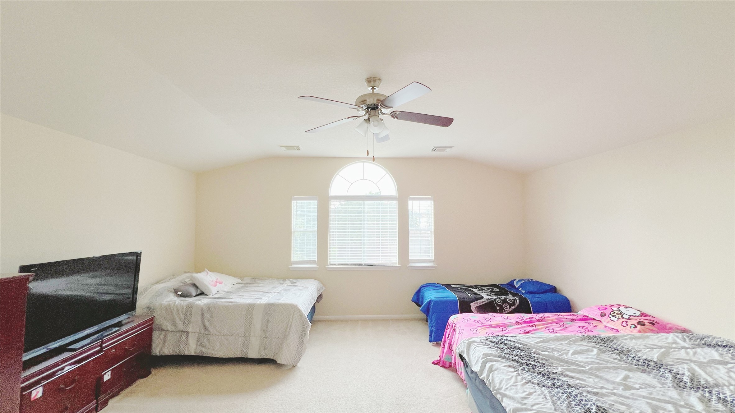 21338 Bella Mountain Drive Spring, TX 77379 - Photo 26 of 33 a bedroom with a bed and a flat screen tv