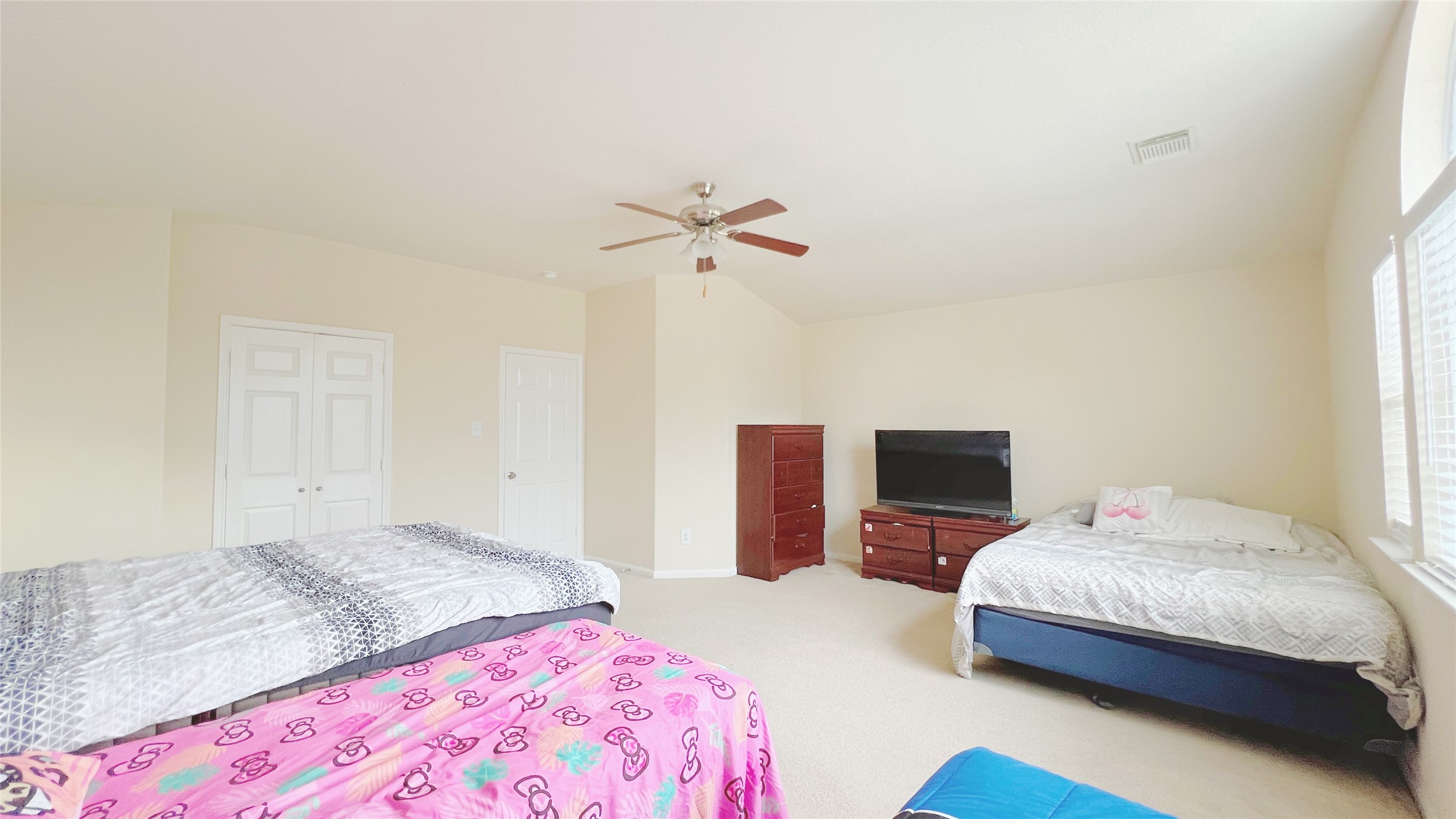 21338 Bella Mountain Drive Spring, TX 77379 - Photo 27 of 33 a bedroom with a bed and a tv