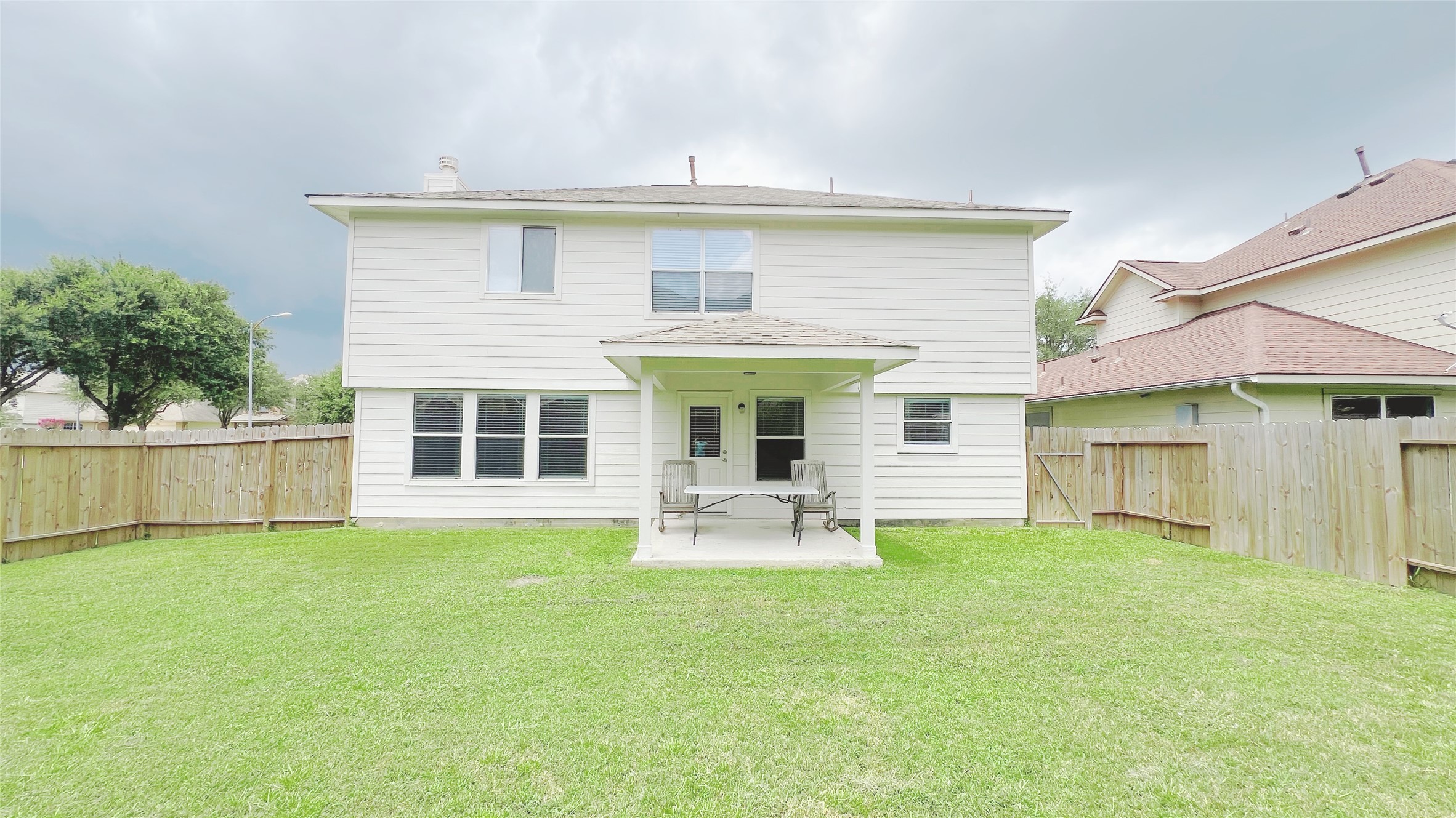 21338 Bella Mountain Drive Spring, TX 77379 - Photo 33 of 33 a view of a house with a yard and sitting area