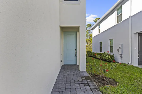 a view of a house with a small yard