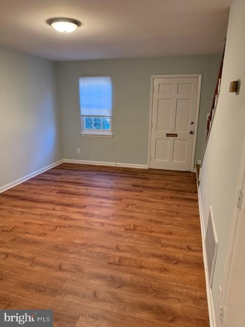 1103 Prince Edward Street, Unit 2 Fredericksburg, VA 22401 - Photo 2 of 7 a view of an empty room and wooden floor