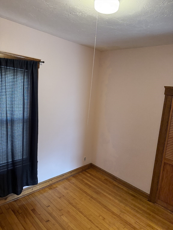 32 Clifton Street, Unit 2 Worcester, MA 01610 - Photo 12 of 12 a view of empty room with wooden floor