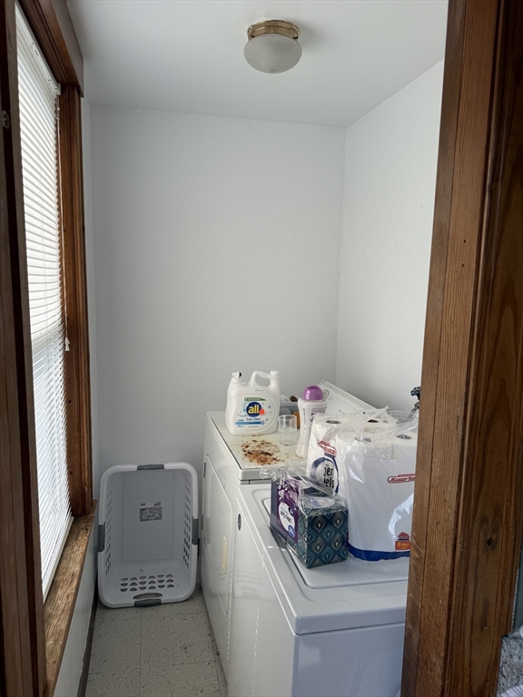 32 Clifton Street, Unit 2 Worcester, MA 01610 - Photo 6 of 12 a utility room with a window dryer and washer
