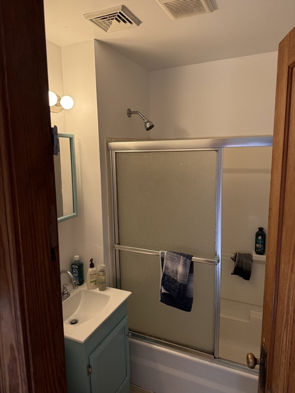 32 Clifton Street, Unit 2 Worcester, MA 01610 - Photo 10 of 12 a bathroom with a sink and mirror