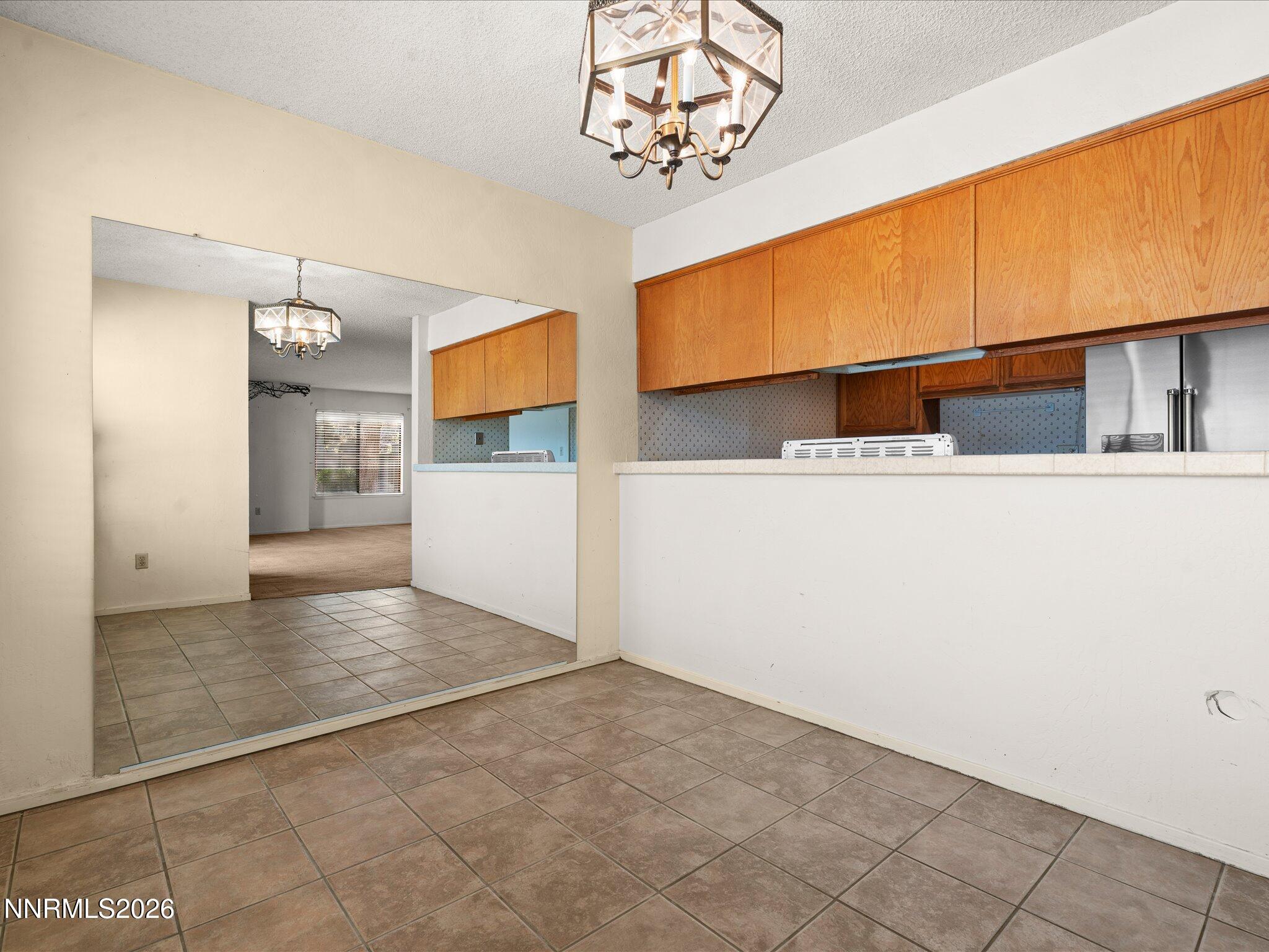 2845 Idlewild Drive, Unit 102 Reno, NV 89509 - Photo 11 of 44 a view of a hallway with a kitchen