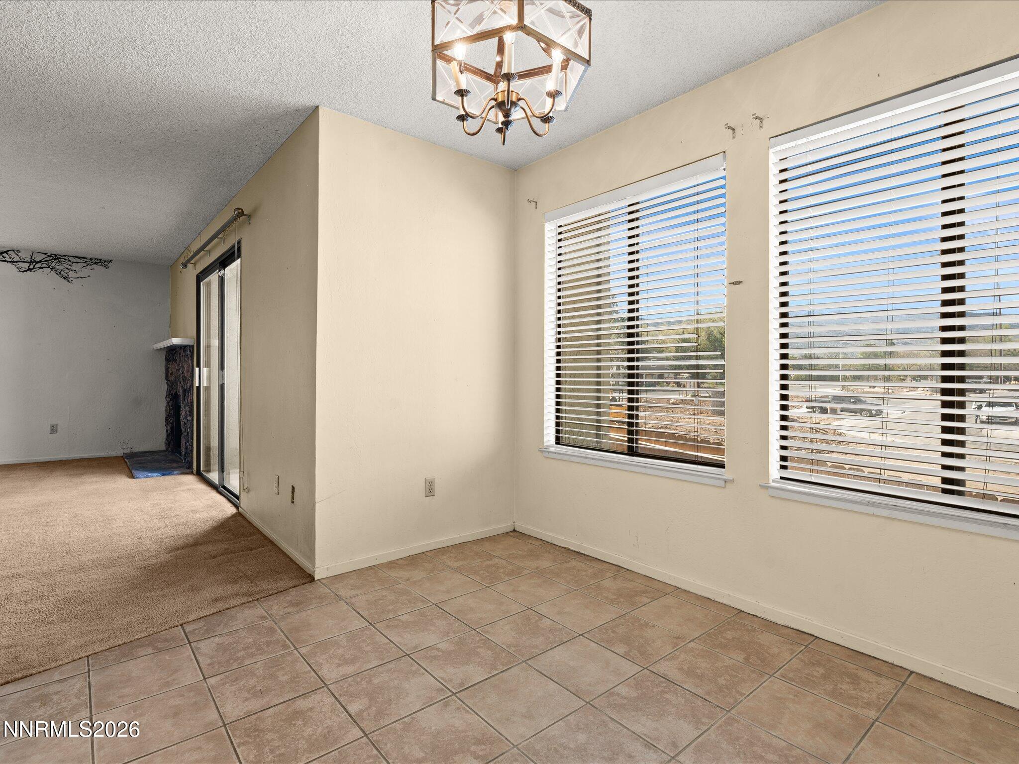 2845 Idlewild Drive, Unit 102 Reno, NV 89509 - Photo 12 of 44 a view of an empty room with a window