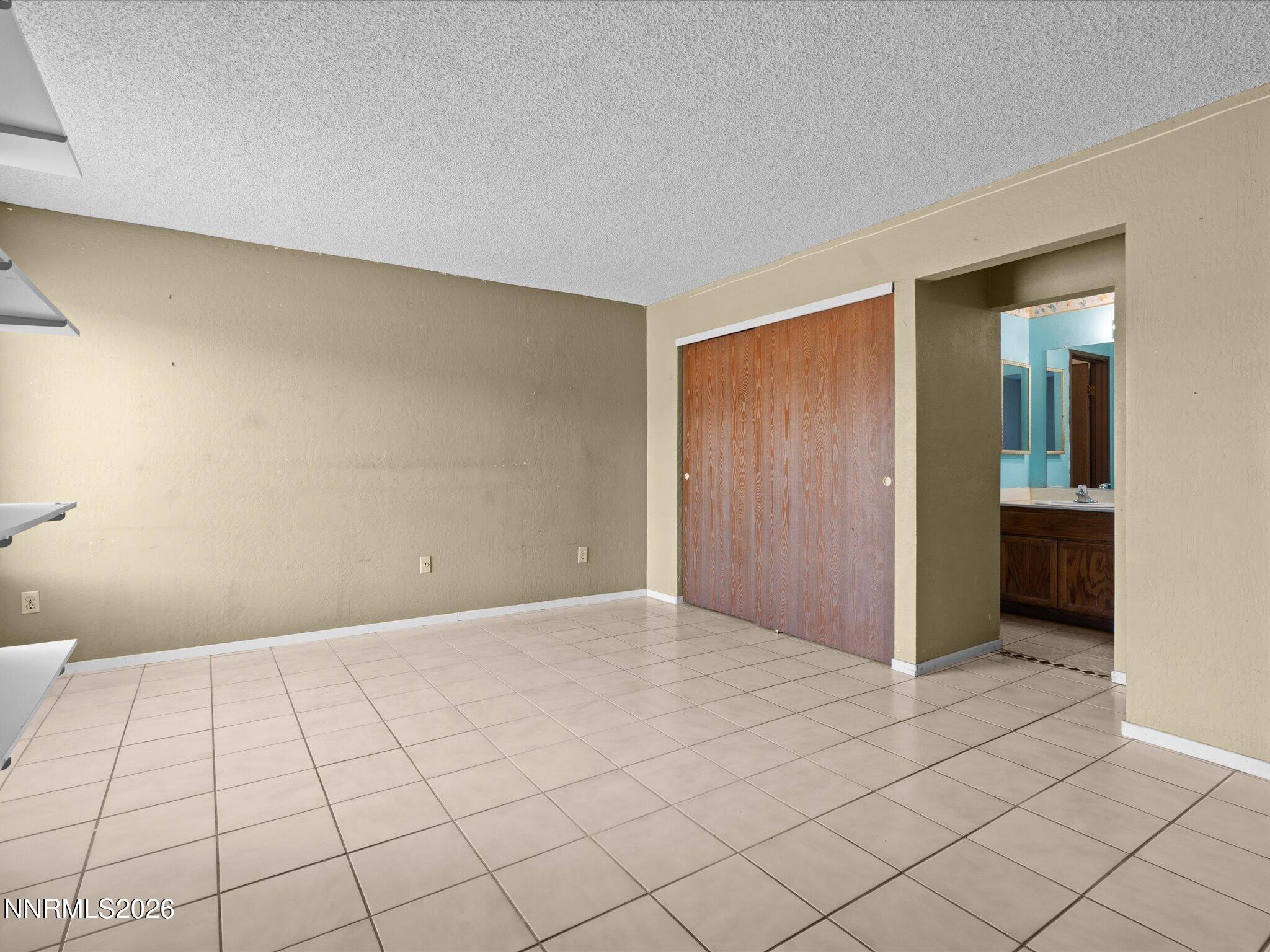 2845 Idlewild Drive, Unit 102 Reno, NV 89509 - Photo 17 of 44 a view of an empty room and window