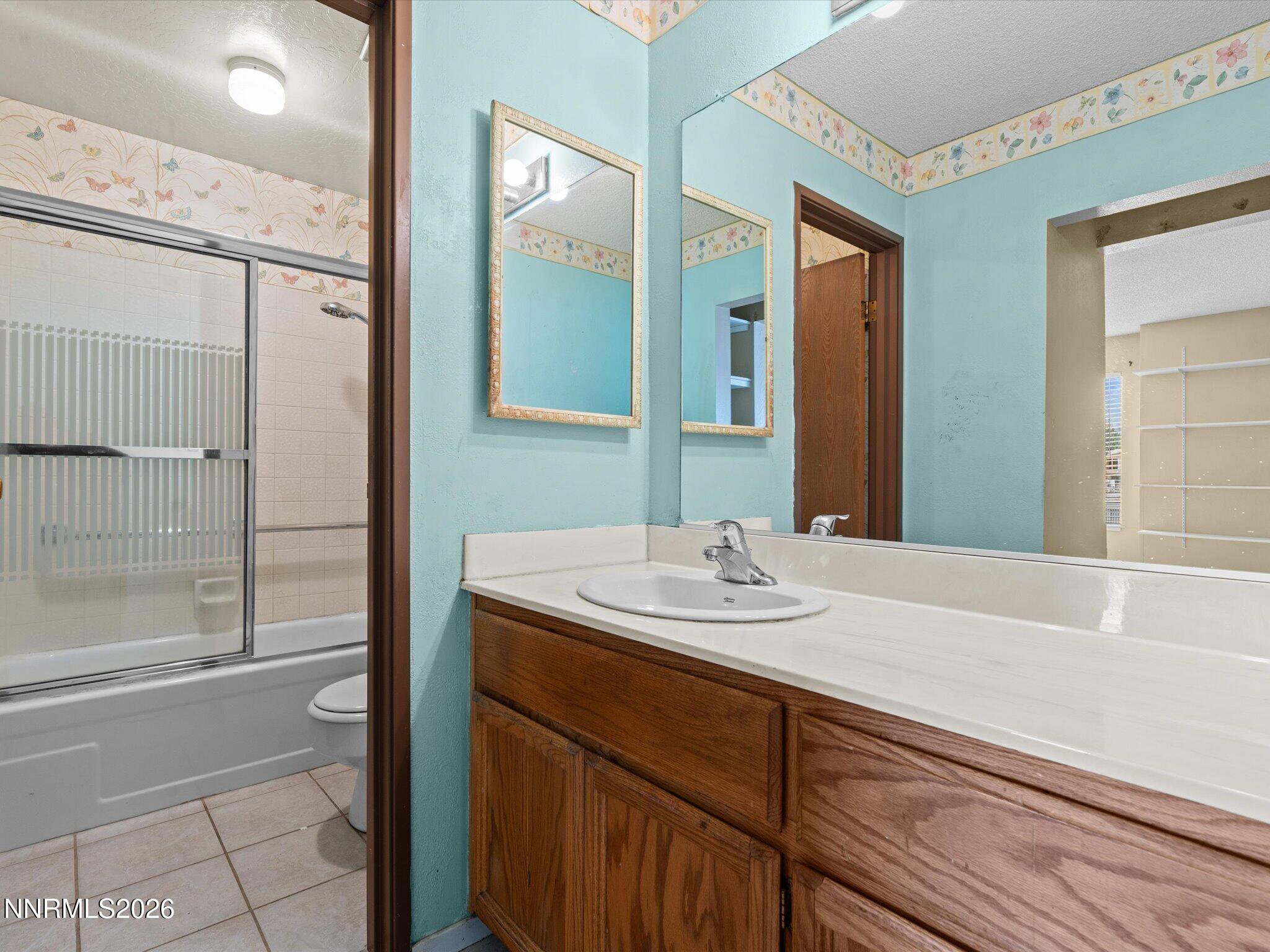 2845 Idlewild Drive, Unit 102 Reno, NV 89509 - Photo 19 of 44 a bathroom with a sink and a mirror