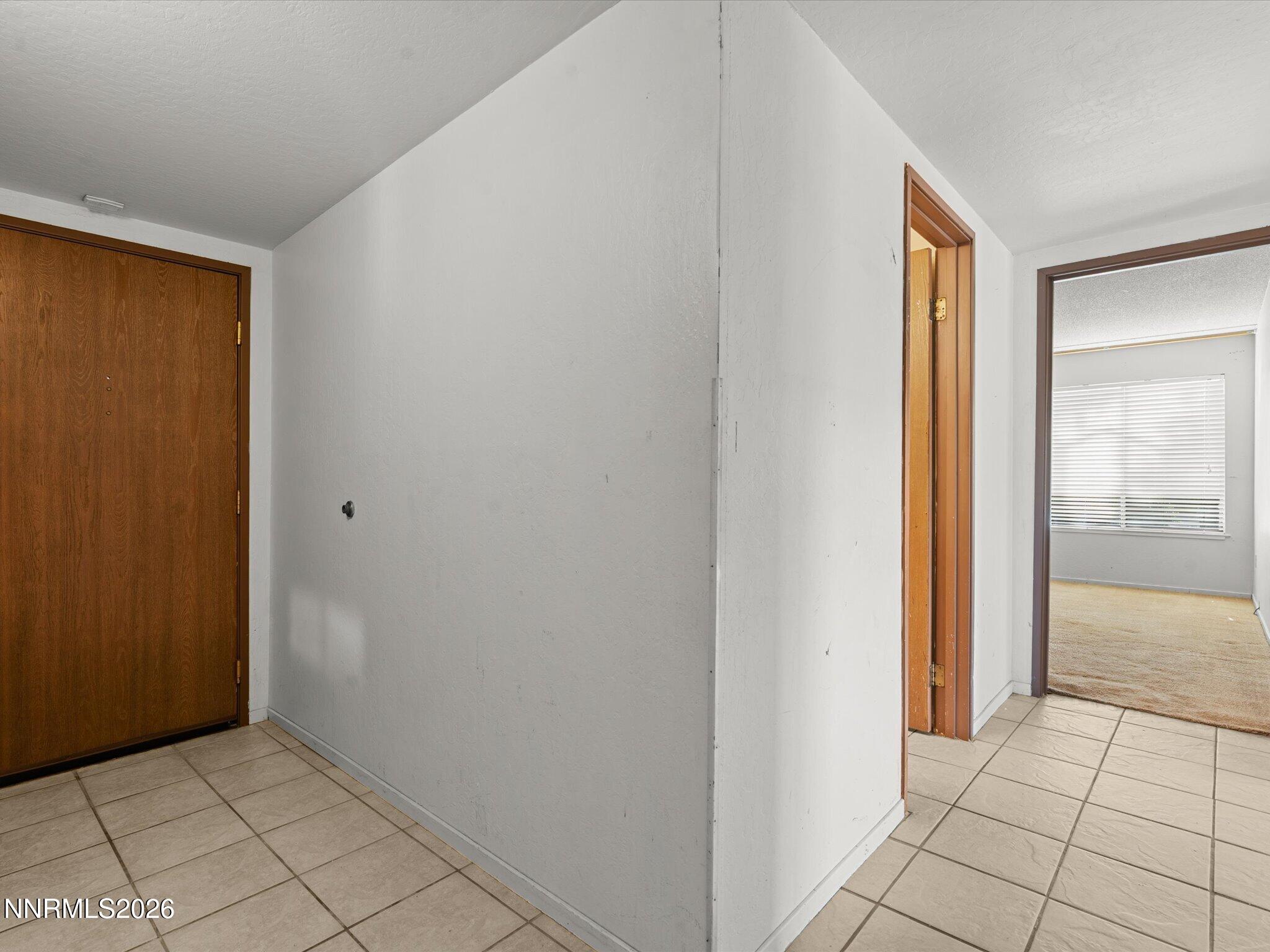 2845 Idlewild Drive, Unit 102 Reno, NV 89509 - Photo 21 of 44 a view of an empty room with window