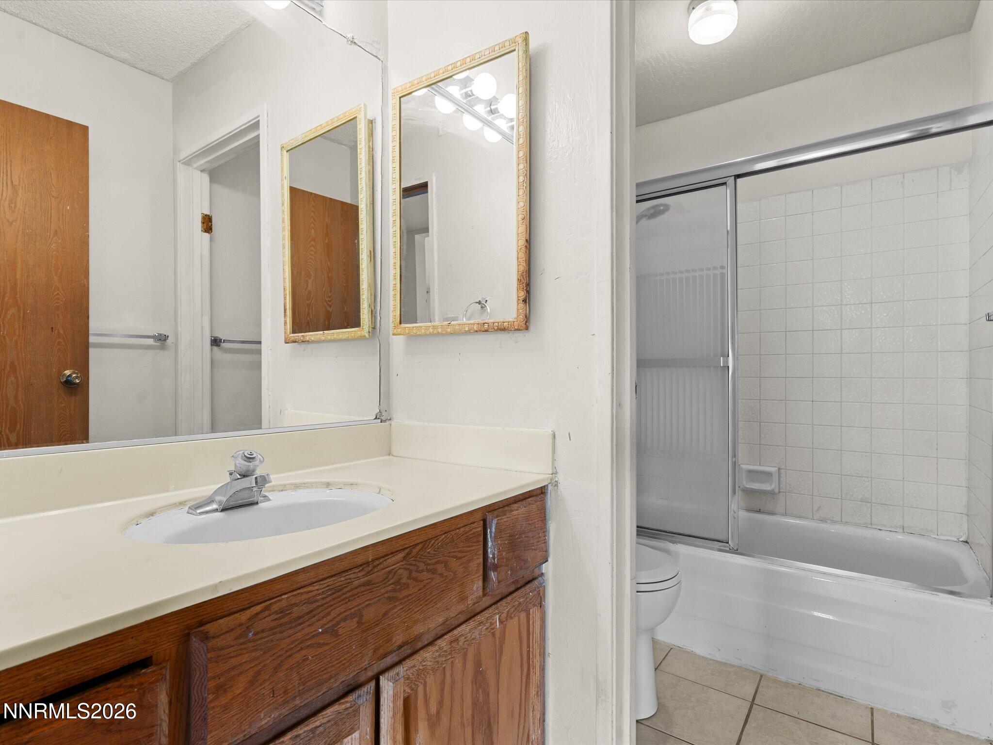 2845 Idlewild Drive, Unit 102 Reno, NV 89509 - Photo 25 of 44 a bathroom with a sink and a mirror