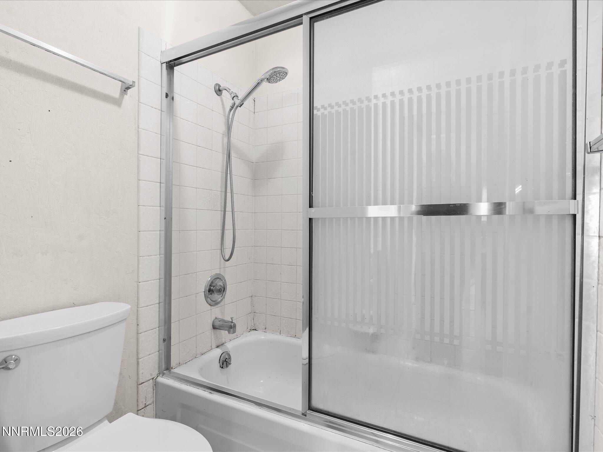 2845 Idlewild Drive, Unit 102 Reno, NV 89509 - Photo 26 of 44 a bathroom with a shower and a toilet