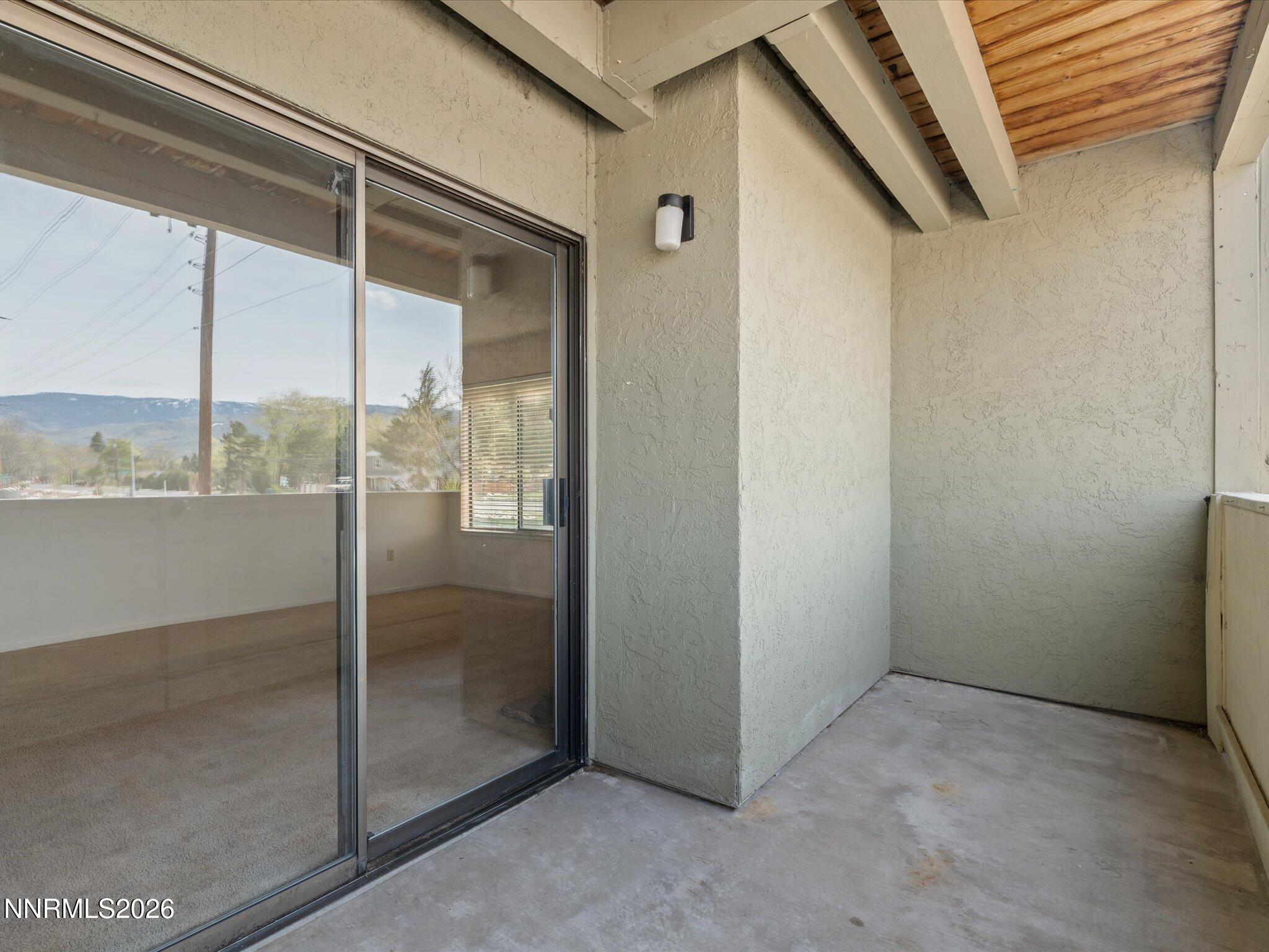 2845 Idlewild Drive, Unit 102 Reno, NV 89509 - Photo 29 of 44 a view of a glass door of the house