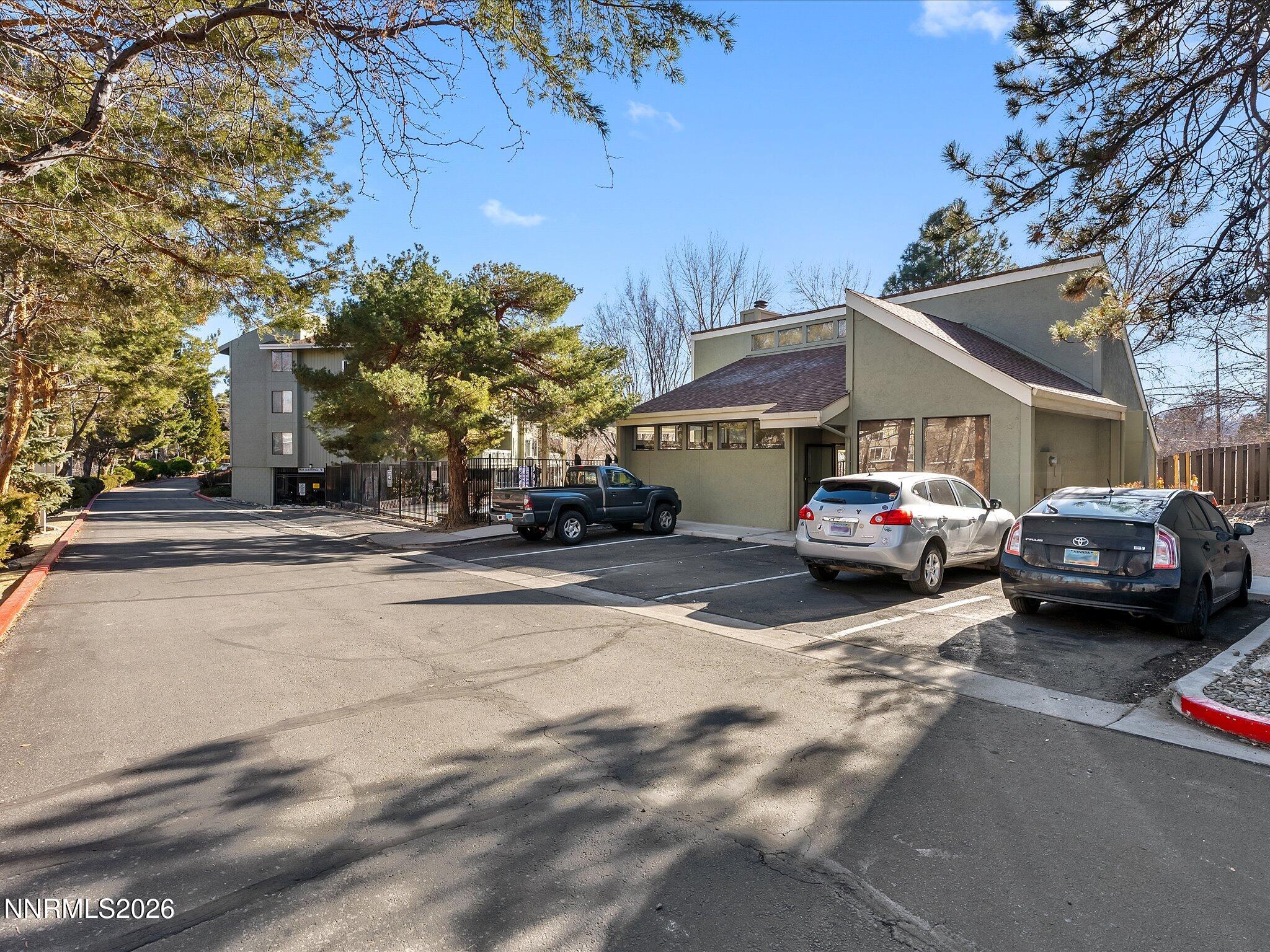 2845 Idlewild Drive, Unit 102 Reno, NV 89509 - Photo 38 of 44 a view of a cars parked on the side of a street