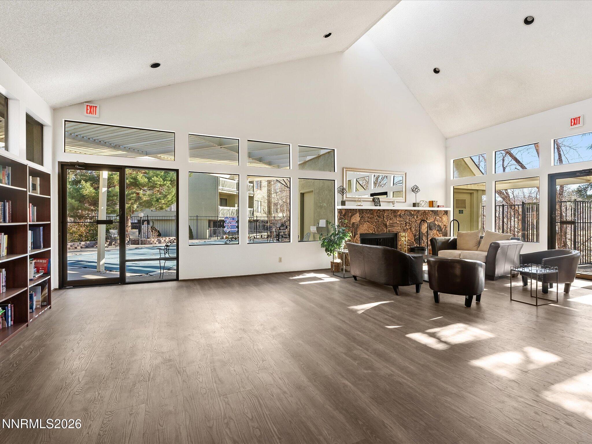 2845 Idlewild Drive, Unit 102 Reno, NV 89509 - Photo 40 of 44 a living room with furniture large window and flat screen tv