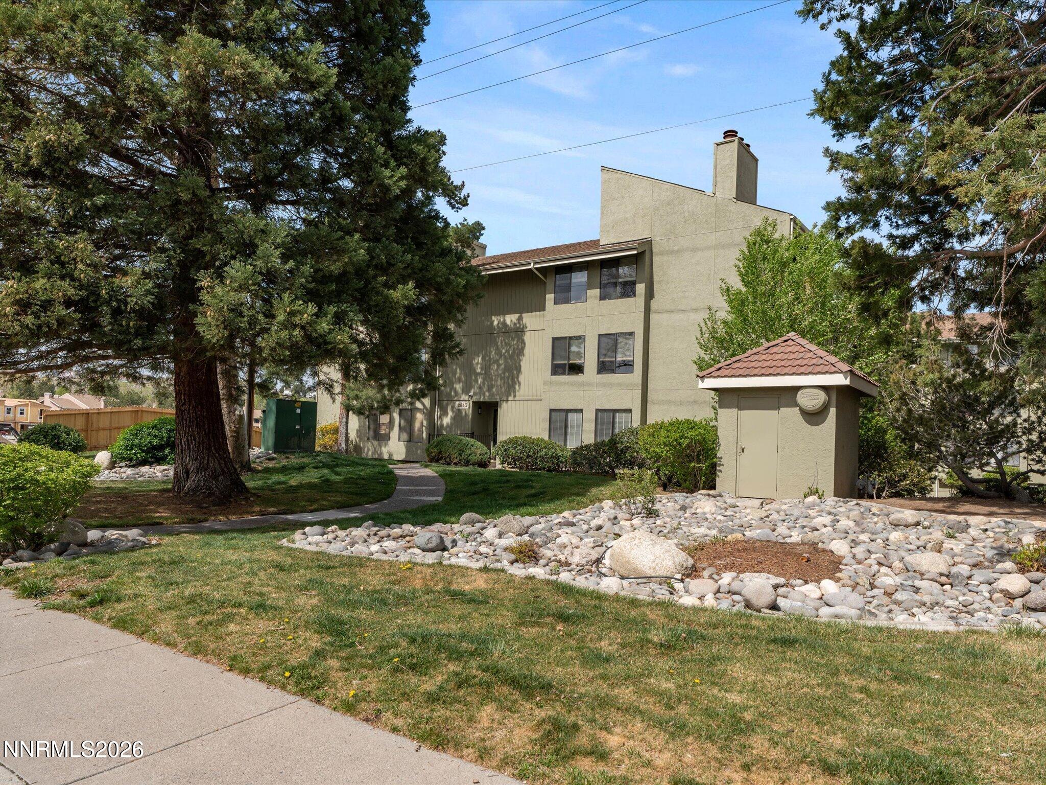 2845 Idlewild Drive, Unit 102 Reno, NV 89509 - Photo 4 of 44 a view of a house with a yard