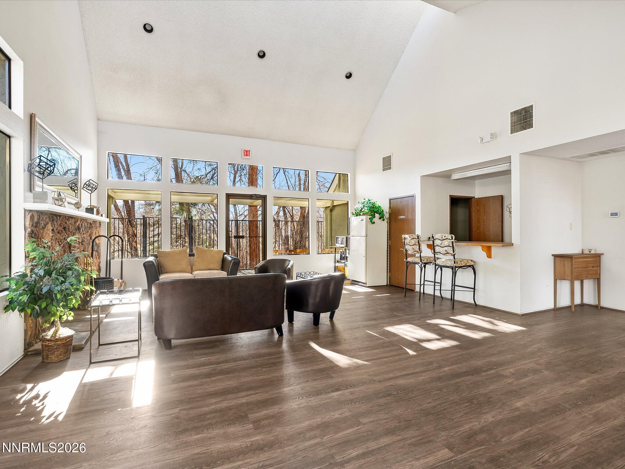 2845 Idlewild Drive, Unit 102 Reno, NV 89509 - Photo 41 of 44 a living room with furniture and a flat screen tv