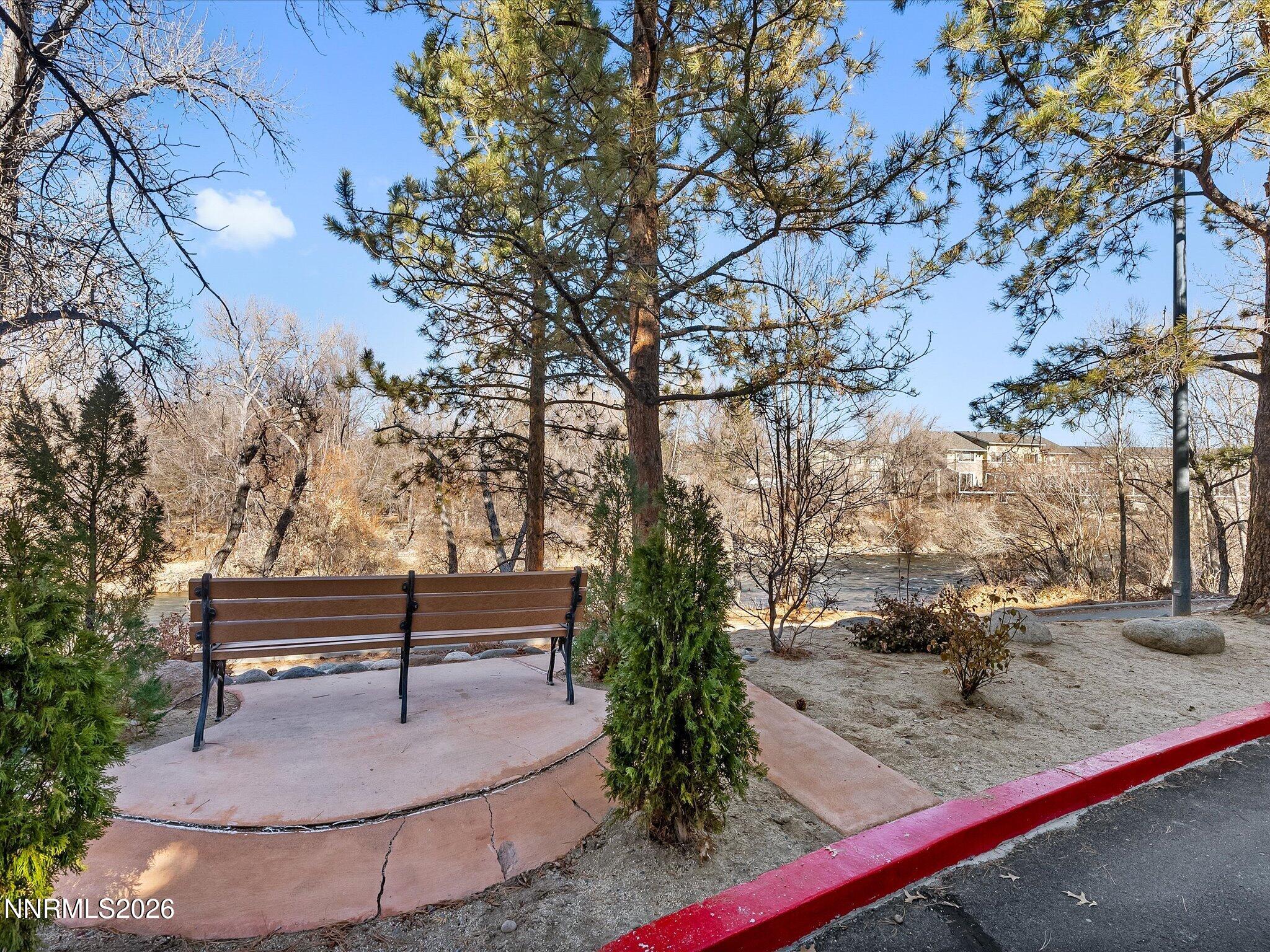 2845 Idlewild Drive, Unit 102 Reno, NV 89509 - Photo 42 of 44 a bench sitting in middle of forest