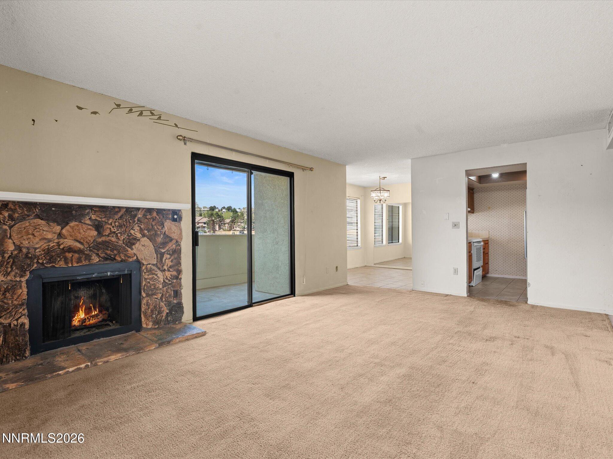 2845 Idlewild Drive, Unit 102 Reno, NV 89509 - Photo 8 of 44 a view of empty room with a fireplace