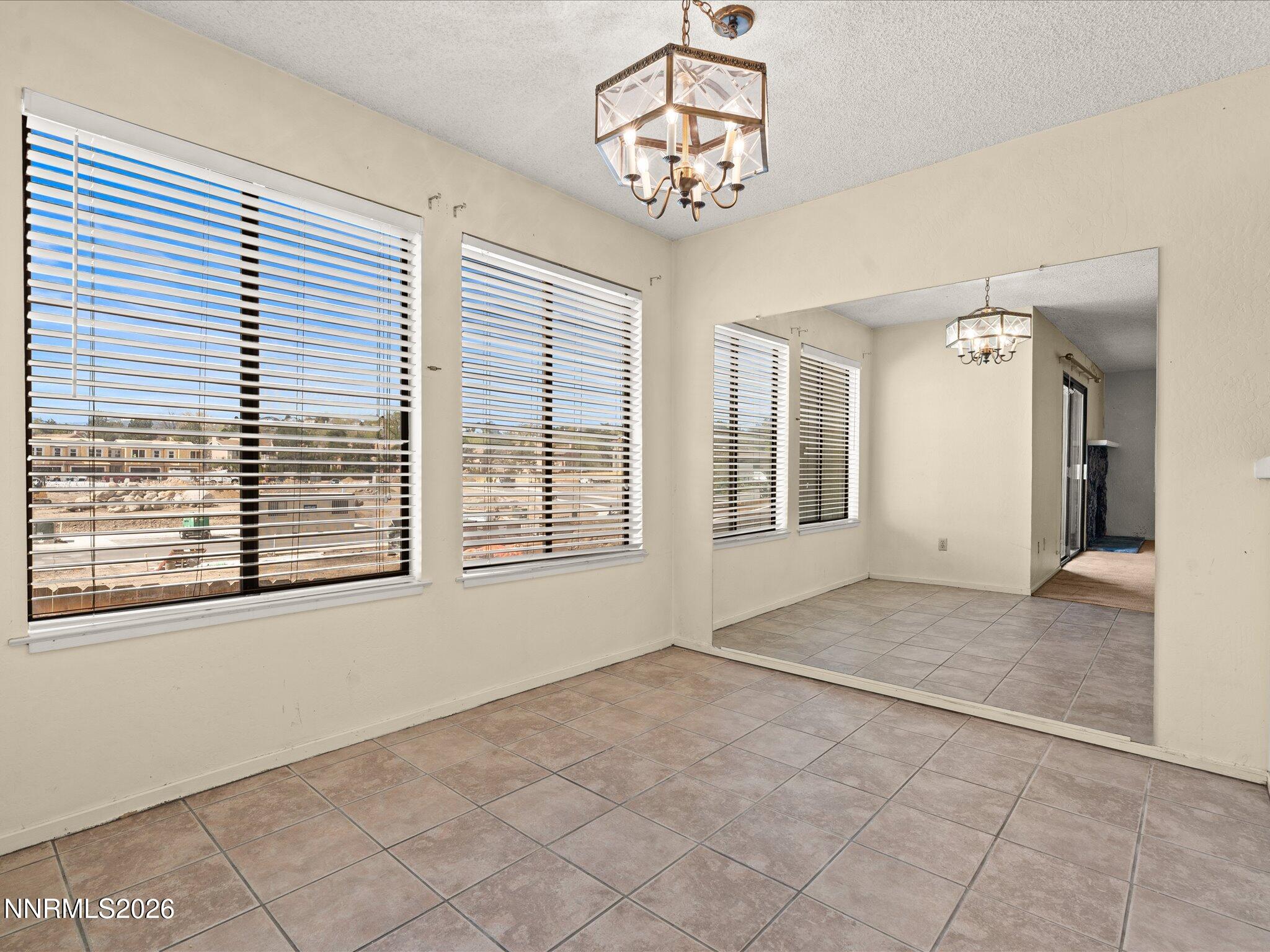 2845 Idlewild Drive, Unit 102 Reno, NV 89509 - Photo 10 of 44 a view of an empty room with a window