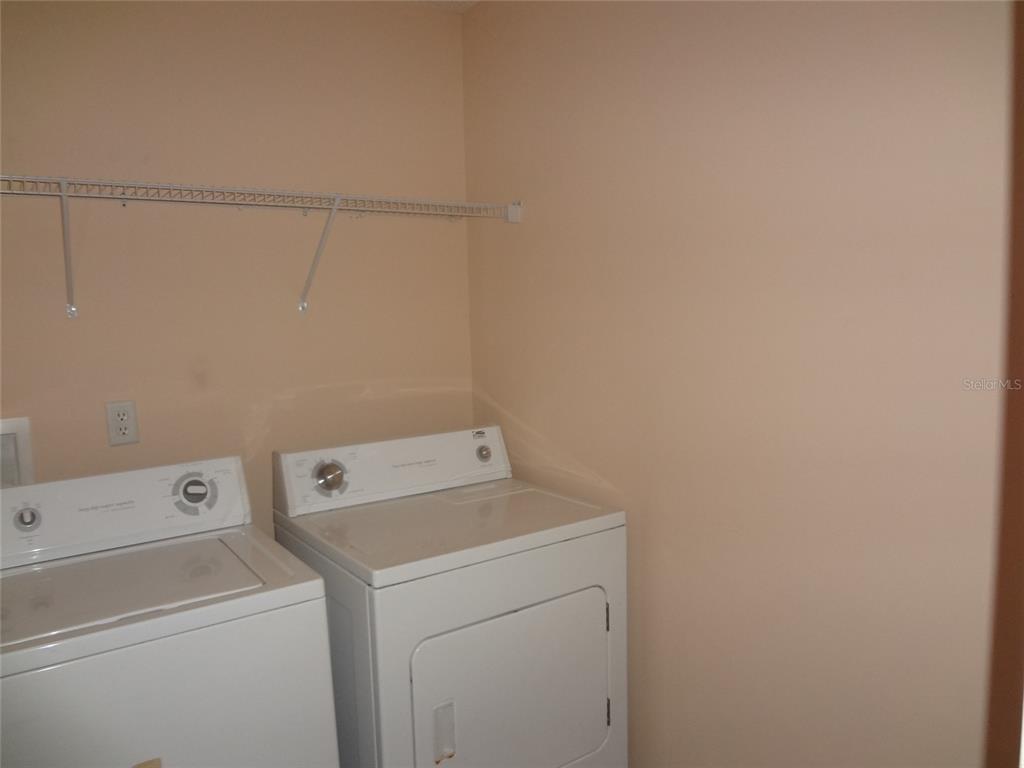 6 Buffalo Grove Drive Palm Coast, FL 32137 - Photo 11 of 24 a utility room with dryer and washer
