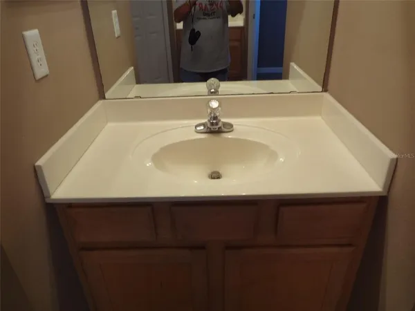 a close view of a sink and a mirror