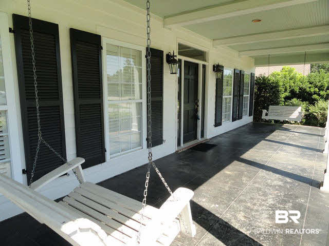 3 Patrice Trace Daphne, AL 36527 - Photo 2 of 22 Large Front Porch with Scored and Stained Concrete and Bead Board Ceiling