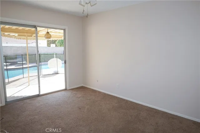 a bathroom with a granite countertop sink toilet and a mirror