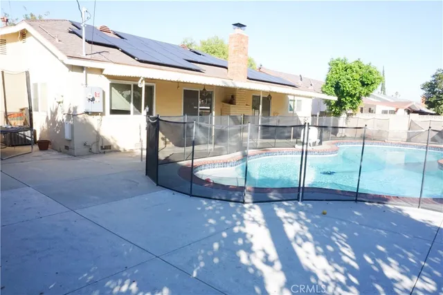 a view of a patio with table and chairs potted plants with wooden floor