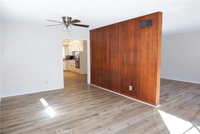 a view of a livingroom with wooden floor