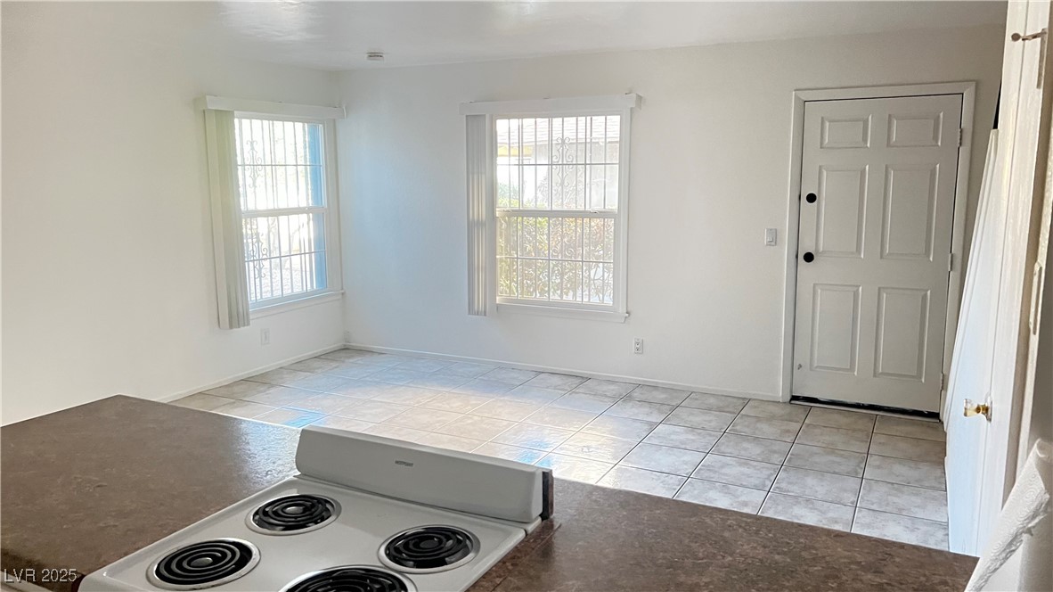 1441 Dorothy Avenue, Unit 2 Las Vegas, NV 89119 - Photo 8 of 20 Foyer entrance with light tile patterned flooring