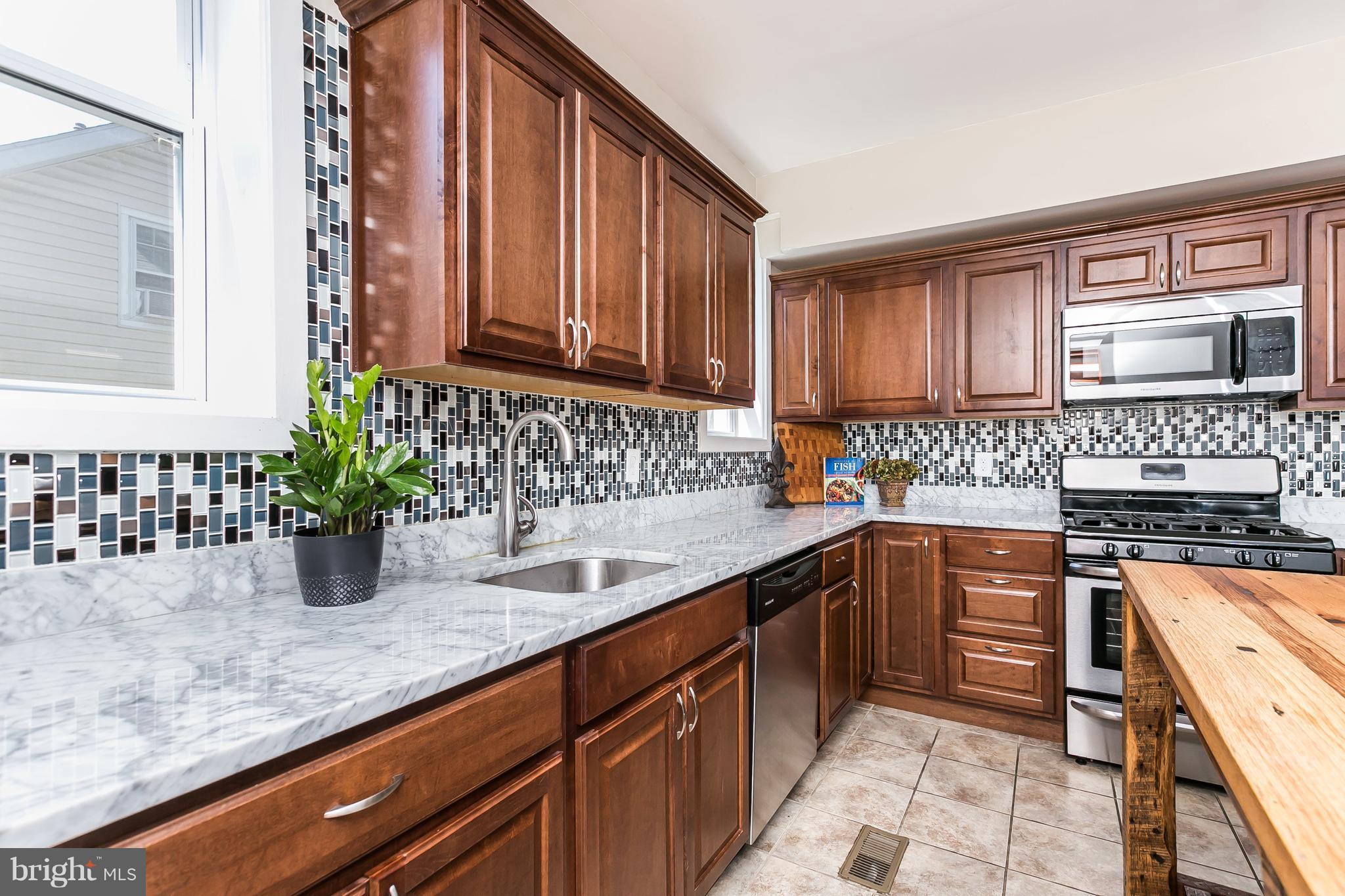 11 Ridge Road Baltimore, MD 21228 - Photo 7 of 30 Carrara marble counters, ceramic tile backsplash