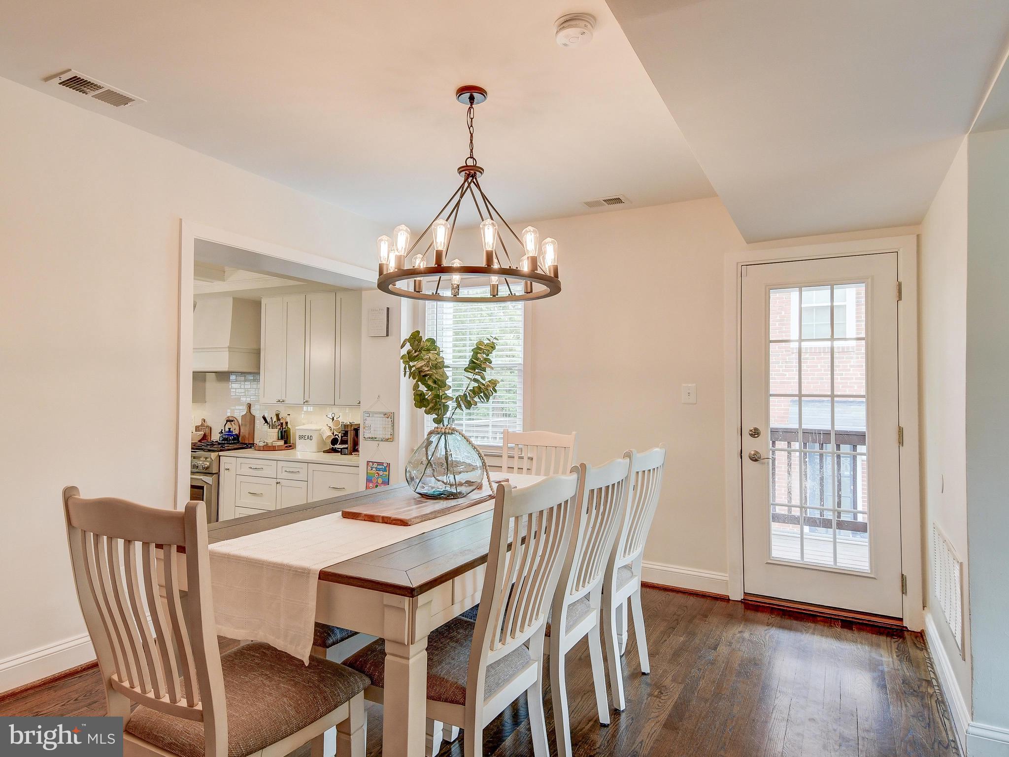 6621 Loch Hill Road Baltimore, MD 21239 - Photo 9 of 45 Dining Room with Hardwood floors with side door