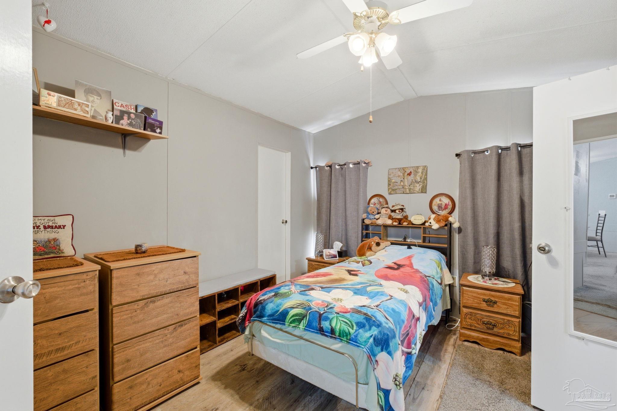 8962 Bluebell Street Milton, FL 32583 - Photo 15 of 35 a room that has a bed and a closet