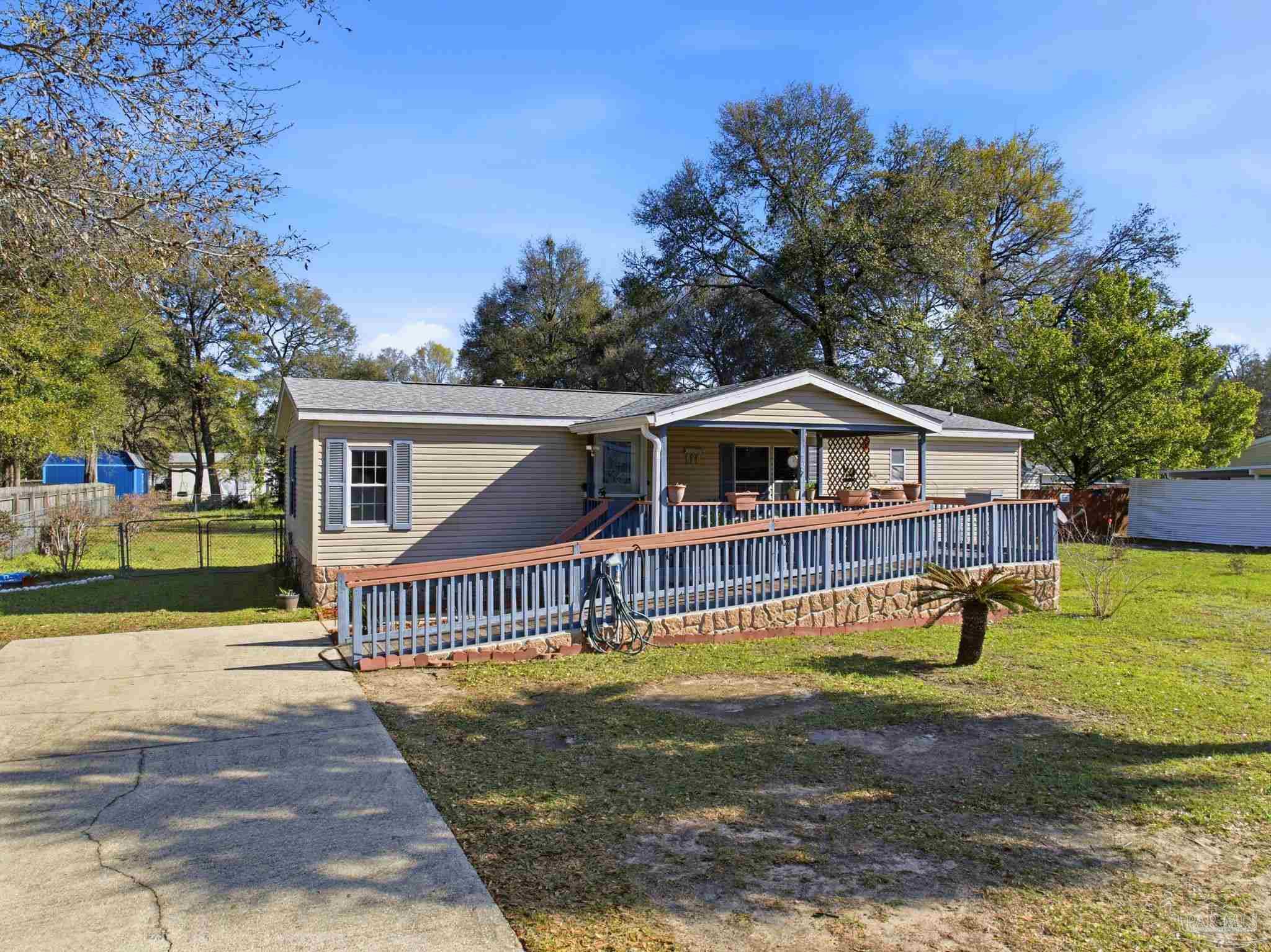 8962 Bluebell Street Milton, FL 32583 - Photo 2 of 35 a view of a house with a yard