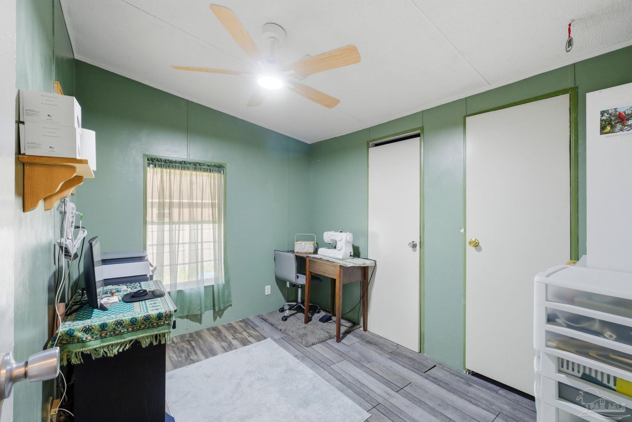 8962 Bluebell Street Milton, FL 32583 - Photo 23 of 35 a workspace with furniture and a window