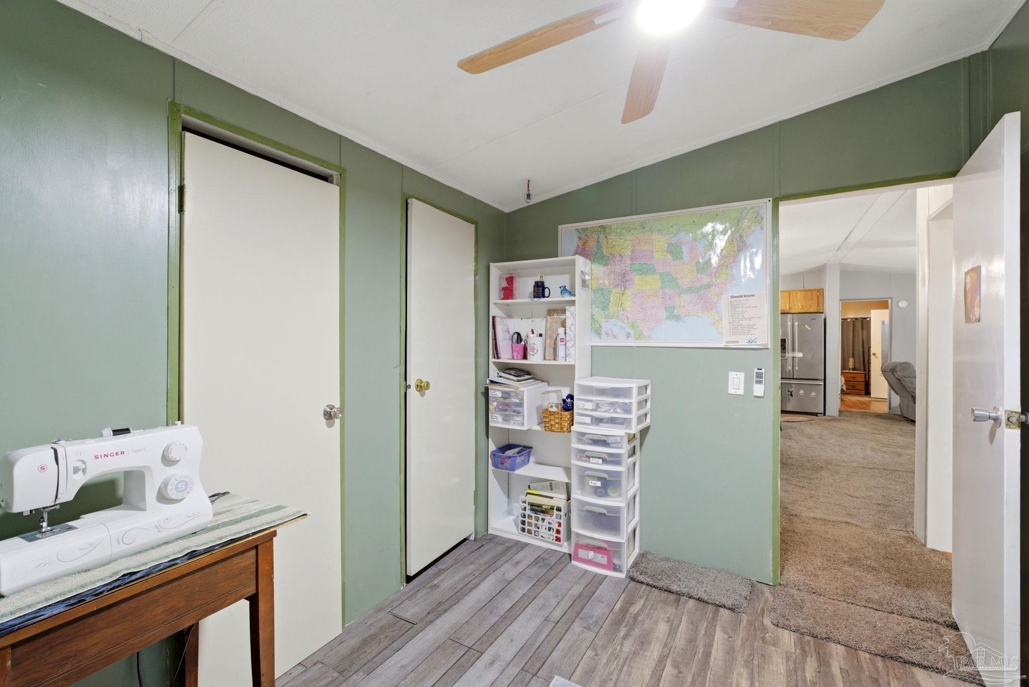 8962 Bluebell Street Milton, FL 32583 - Photo 25 of 35 a room with furniture and wooden floor