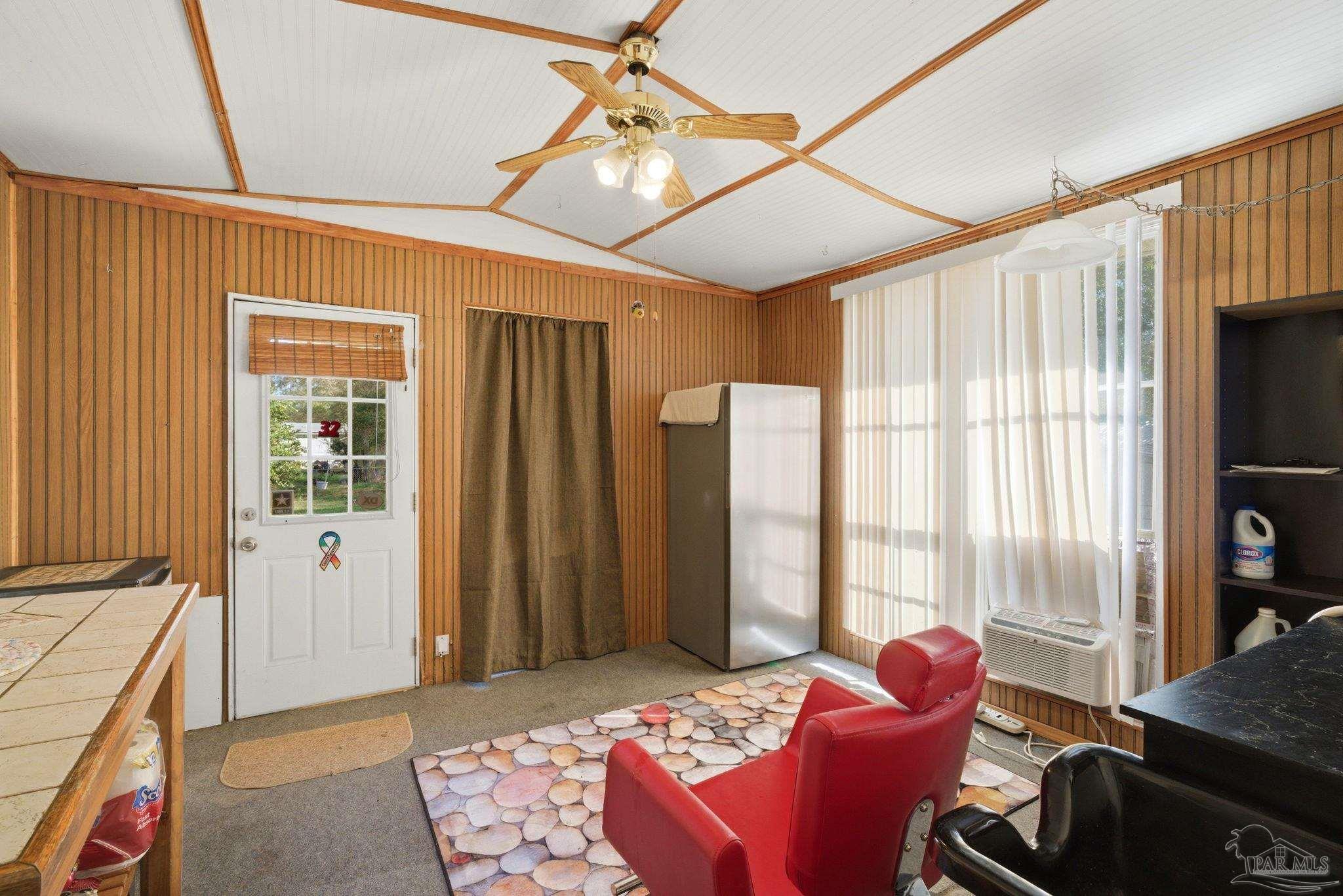 8962 Bluebell Street Milton, FL 32583 - Photo 27 of 35 a bedroom with furniture and a window