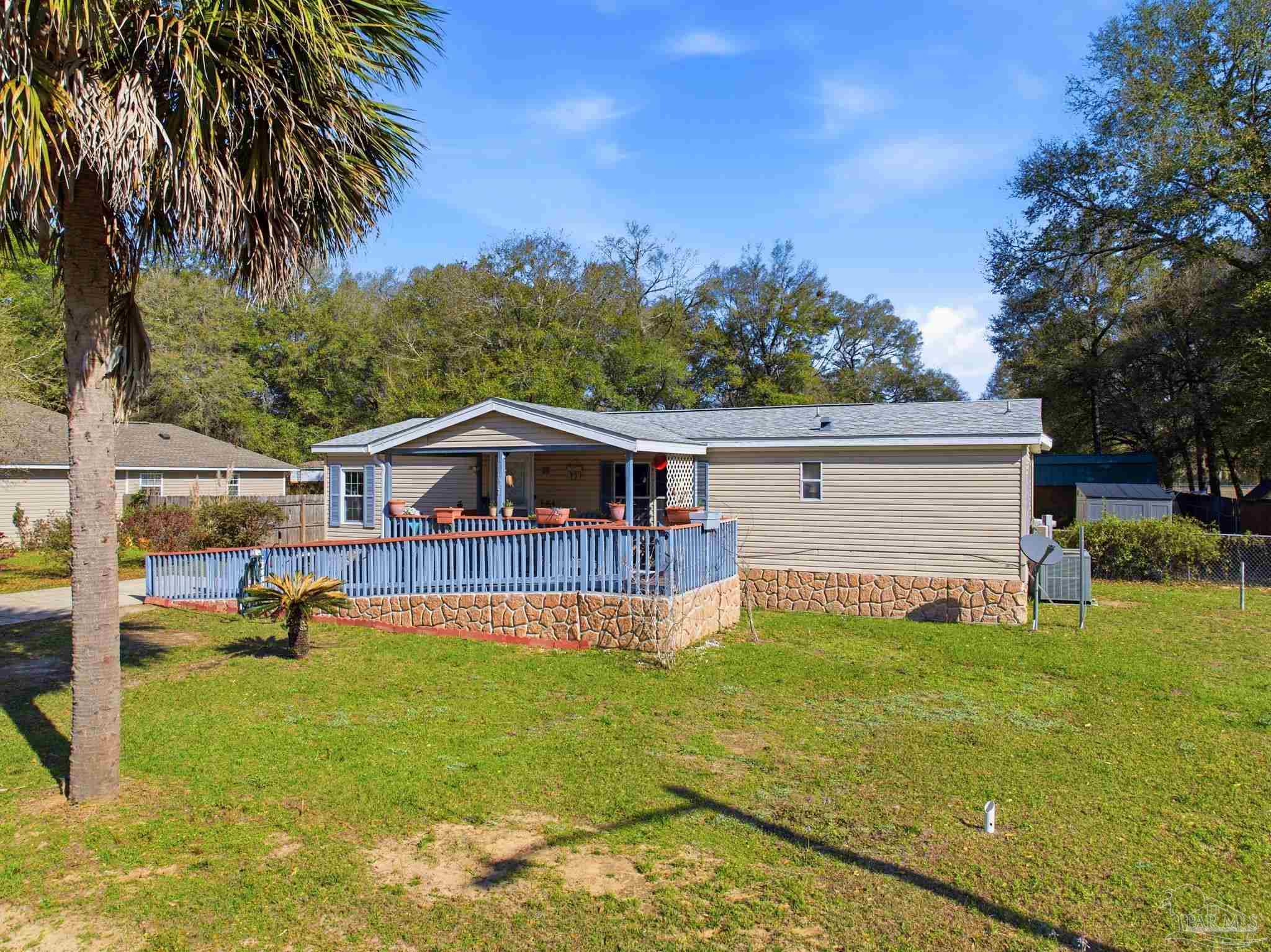 8962 Bluebell Street Milton, FL 32583 - Photo 3 of 35 a view of a house with a yard