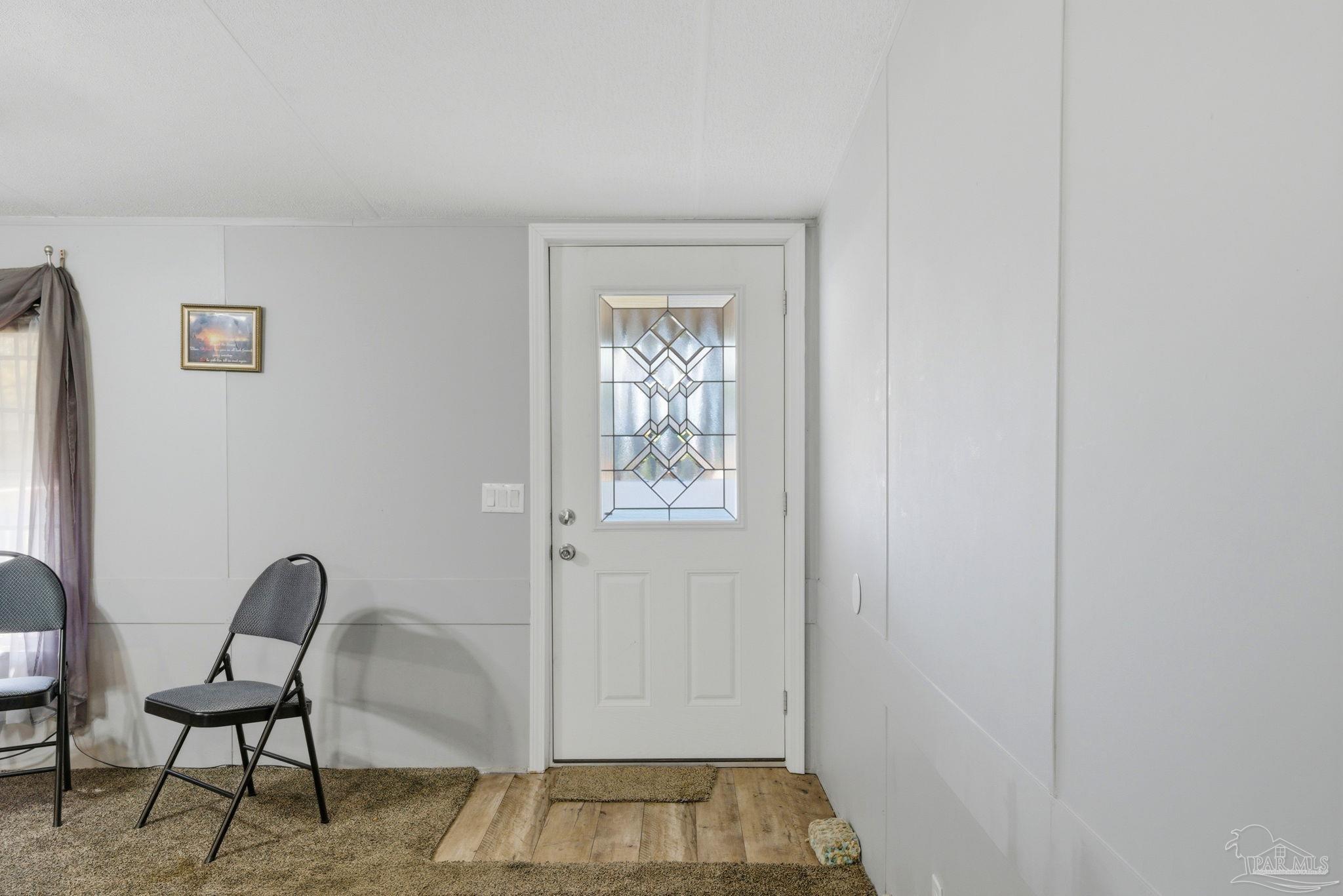 8962 Bluebell Street Milton, FL 32583 - Photo 6 of 35 a view of a livingroom with furniture and a window