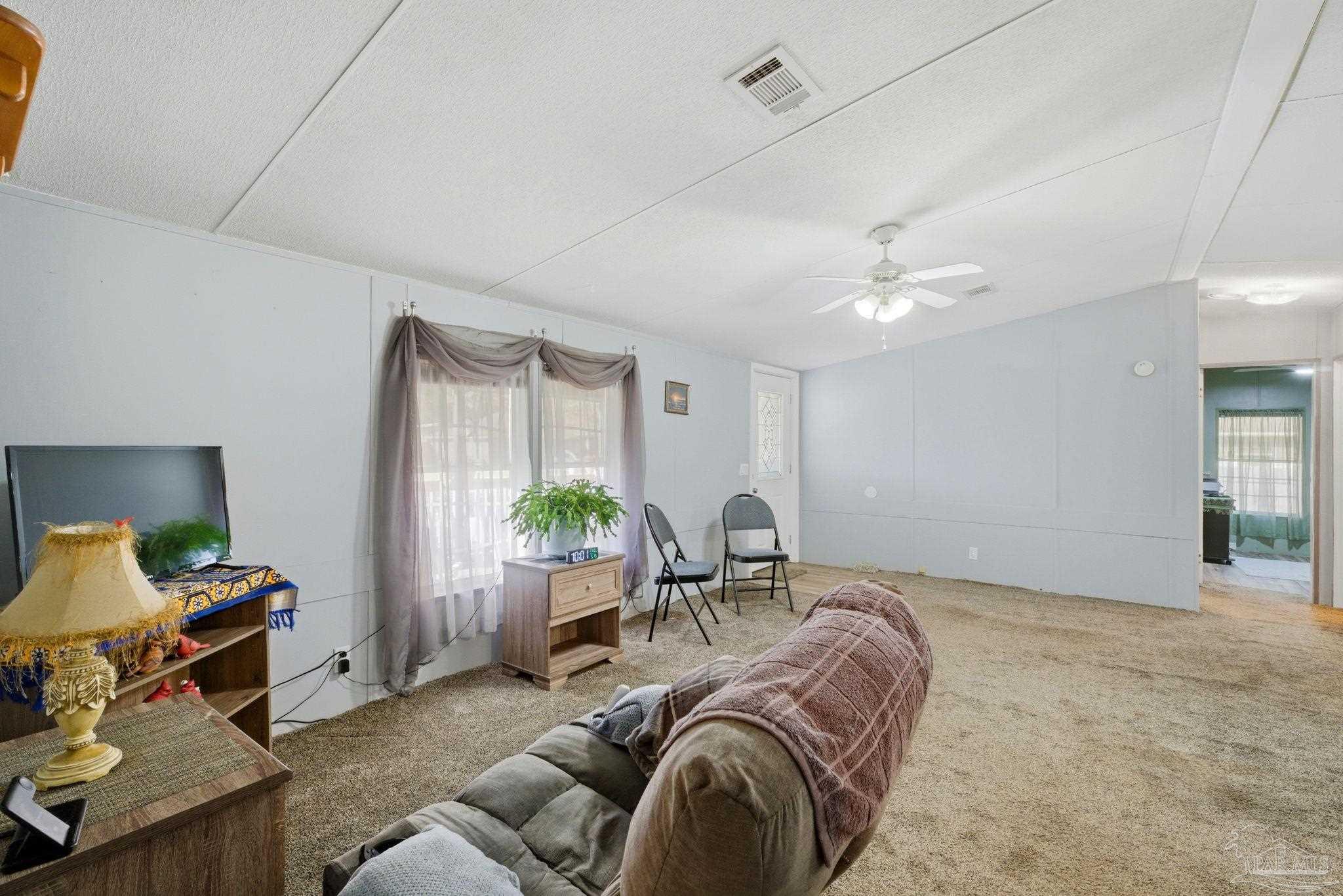 8962 Bluebell Street Milton, FL 32583 - Photo 9 of 35 a living room with furniture