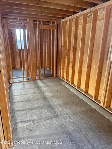 a view of a room with staircase and door