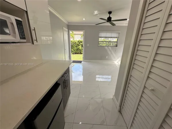 a bathroom with a sink a toilet and shower curtain