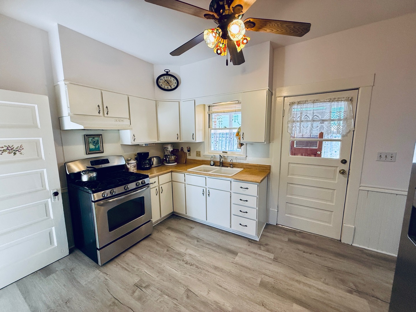 742 South 4th Street DeKalb, IL 60115 - Photo 5 of 46 a kitchen with stainless steel appliances a stove a sink and a refrigerator