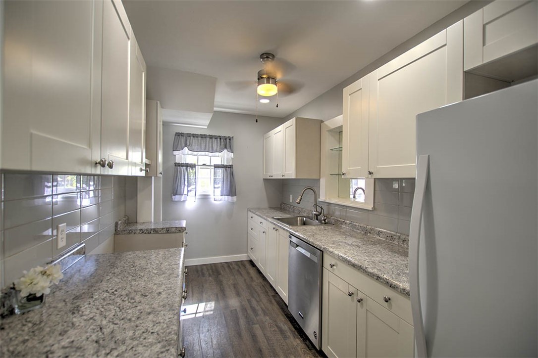 435 North Summit Avenue Decatur, IL 62522 - Photo 18 of 33 a kitchen with a sink stove and cabinets
